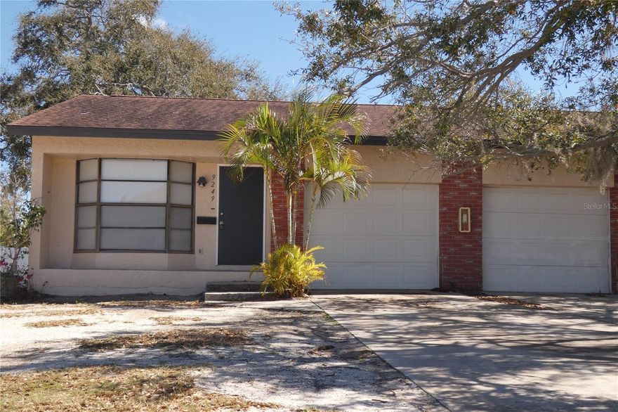 Amazing triplex opportunity in Gateway area of north St Petersburg on a corner double lot.  Excellent location with (3) 2 bedroom 1 bathroom units with attached 1 car garages.  Each apt has washer dryer connections.  Spacious at over 900 sq ft per unit. Block construction. Separate electric & water meters for each apt.  No flooding inside living space as the building is elevated.  Extra parking for guests.  With updating and TLC, this building can be an excellent income property.  New roof 2010 Live in 1, rent the others for income. Potential Market rents are substantially higher with updating.  All 3 floorplans are the same.  Do not disturb tenants. 2 long term residents, 1 apt is vacant and ready for renovation.  Rent roll available.  Convenient to 275, bay bridges and downtown St Petersburg.