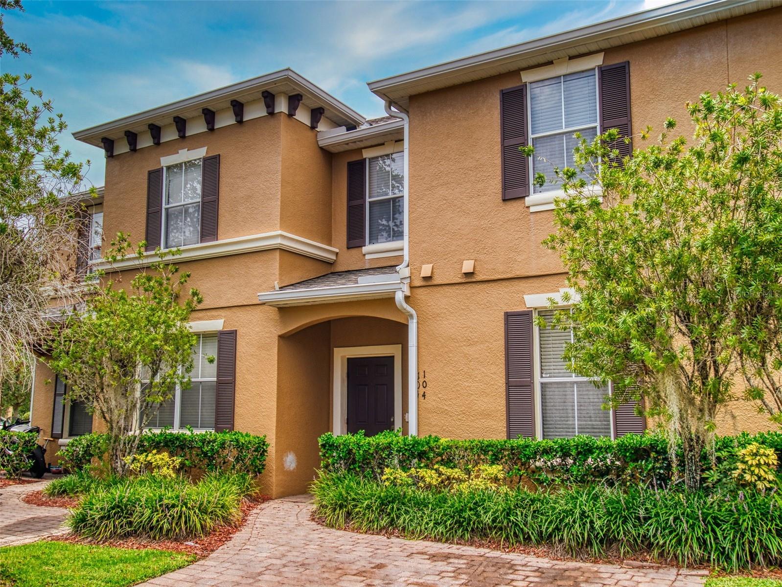 Elegant 4-Bedroom Townhome in Prime Daytona Location! Welcome to Grande Champion at LPGA International—where convenience meets comfort. This spacious 4-bed, 3-bath townhome offers an open floor plan ideal for both large families and savvy investors. The first floor features tile flooring, a generous living and dining area, a full bedroom and bath perfect for guests or a home office, and a well-equipped kitchen with ample cabinetry. Upstairs, you'll find three additional bedrooms, including a serene primary suite with a walk-in closet and garden tub. Step outside to a private covered patio and grassy yard—great for entertaining, grilling, or playtime. Community perks include a sparkling pool and cabana, with the HOA covering exterior paint, roof maintenance, and landscaping for easy living. Enjoy unbeatable proximity to I-95, I-4, Daytona Beach, Daytona International Speedway, top universities, shopping, dining, and the airport. Live where others vacation- Florida living at it's best!