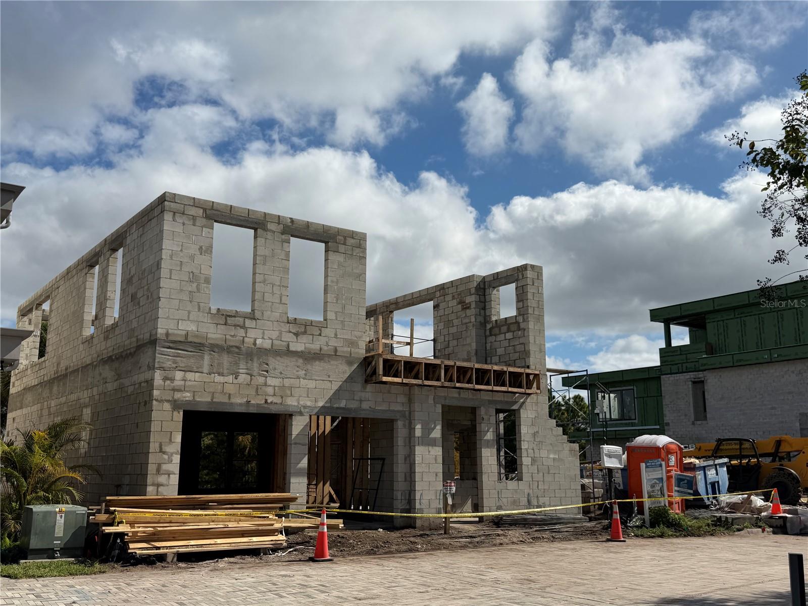 Under Construction. Your BRAND-NEW Waterfront Custom home in Laureate Park, Lake Nona with Elevator and 4 STORIES of gorgeous high-end finishes, outdoor living from every floor, and an incredible location in the heart of the neighborhood, by Talbot Custom Homes.  This unique 4-story residence features a dramatic open foyer and each level is thoughtfully designed to be utilized in a number of different ways.  From the downstairs lakeside entry and bedroom suite, to the 2nd level with additional primary suite and 2 other bedrooms, flex room and water-views balcony- to the 3rd floor kitchen and luxurious primary bath, there's something for everyone with enough indoor and outdoor space to enjoy in every corner of the property.  Heading up to the 4th level you have an outdoor sun deck to enjoy the florida sunshine. Talbot Custom Homes is quickly becoming known for their quality builds all over Orlando with nothing but the best finishes including Thermador appliances, custom cabinetry, designer lighting and beautiful bath fixtures, decorative details, and the ability to customize for each homeowner really sets them apart. Laureate Park's city center with Canvas Restaurant & Market, the LP fit gym, 2 swimming pools at the Laureate Park Aquatic center is just steps away from this home, along with the Lake Nona Town center, 3 major hospitals, the Wave Hotel, and Orlando International Airport located just a few miles to the west. Inquire today about this never-before-seen layout and experience the joy of owning a custom home in Lake Nona.