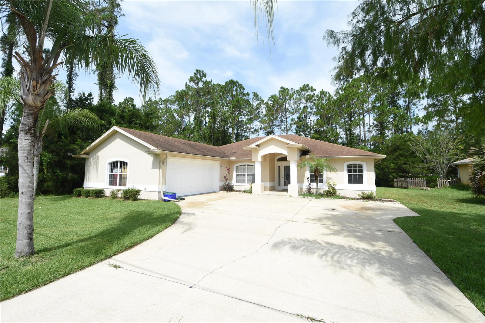Welcome to this beautiful home located in the desirable Lehigh Woods subdivision! This spacious 4 bedroom, 3 bathroom home features over 2000 square feet of living space and has been freshly painted on the exterior. As you enter the home, you are greeted by a formal dining room, perfect for hosting family dinners and entertaining guests. The large living room is perfect for relaxing and spending time with loved ones. The spacious kitchen boasts vaulted ceilings, a pantry, plenty of cabinetry, and counter space, making it ideal for preparing delicious meals. The large master bedroom features a large walk-in closet providing ample space for all of your personal belongings. The master bathroom has a walk-in shower and garden tub, creating a luxurious and relaxing spa-like atmosphere. The spacious laundry room features shelving and a storage closet, making laundry a breeze. The covered lanai offers the perfect area to entertain friends and family, while the large private backyard. Nearby features include Graham Swamp Conservation, walking and biking paths, shopping, dining, and the convenience of I-95. The beach is just minutes away, making it easy to enjoy all that the Florida coast has to offer. Don't miss your chance to own this beautiful home in the sought-after Lehigh Woods subdivision. Call today to book a private showing and see all that this home has to offer!