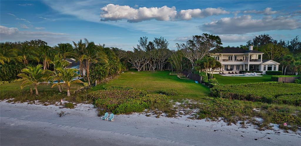 $$MILLION DOLLAR REDUCTION$$. Build the home of your dreams on this expansive lot of 1.3 acres. Your own private white sandy beach on Siesta Key. Situated just forty-five minutes south of Tampa, come see why Sarasota has won so many lifestyle awards as of late. Siesta Key offers the nation’s best beach, “big-city” arts and entertainment, yet is a little more reserved and paced then our neighbors on the east coast of the state and Naples. East to west orientation reveals the most magical sunsets. The long plot affords privacy and separation from the street, while providing a grand entrance to your future residence. The prior home has been leveled, with a vacant lot approved and permitted to build a custom 9,754 square foot estate with tennis court, guest house, and oversized driveway (was listed for $32.5M in MLS as A4554778). OR, start from scratch and build your own vision. All due diligence completed. New survey, tree locations, CCL location, soil tests, etc. Public utilities in place. This lot is extremely rare and ready to build. You won't find another like it.