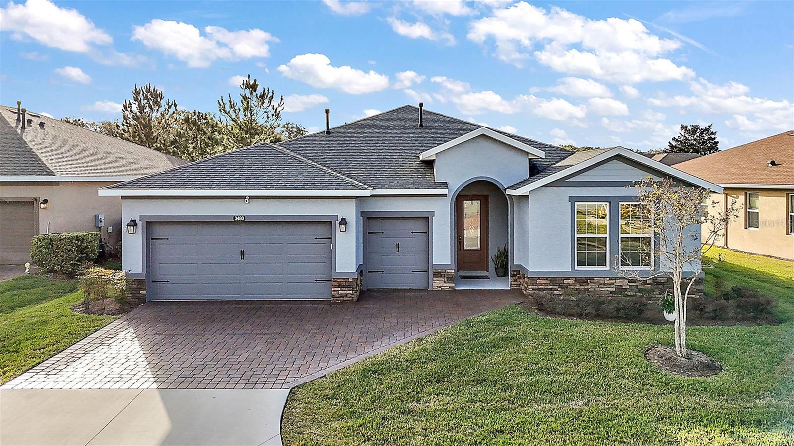 Truly remarkable property, situated in the LUXURY Ocala Preserve, just 4.2 miles away from the World Equestrian Center in Ocala, FL, this 2019 Custom build OPEN CONCEPT by Shea Homes is a masterpiece in modern living. The "Excite" model home, which was the showcase model for Shea Homes, is now available for you to call home. This impeccable residence boasts over 2,000 sq ft of under-air living space, featuring 2 MASTER bedrooms, 2.5 bathrooms, a FLEX ROOM/OFFICE, golf car garage, and a fenced yard. As you step inside, you'll be greeted by an abundance of natural light, high 10’ ceilings throughout, and a spacious living area designed for entertaining. The chef's kitchen is a culinary delight, equipped with natural gas, stainless steel luxury General Electric CAFÉ edition appliances, a tile backsplash, granite counters, oversize island, and more. The master bedroom offers an ensuite with his and hers sinks, a step-in shower, and a walk-in closet, while the second bedroom features its own ensuite with a soaking tub and shower. Additional highlights of this home include upgraded tile floors, a dedicated dining room, a utility sink in the laundry room with matching cabinets, a Ring doorbell, blinds on every window. The OCALA PRESERVE COMMUNITY also includes access to a range of amenities such as resort and lap pools, golf, trails, tennis, pickleball, and a fitness center. HOA fees cover high speed internet, lawn landscape maintenance (cutting, trimming, edging, treating, fertilizing, mulching, irrigation system and water for irrigation). Membership in all amenities includes Fitness Center, outdoor fitness area, group fitness classes, Lap Pool, Golf, 20 miles of dedicated Trails, Tennis, Pickle ball, fishing doc, kayaks, canoes, paddleboats, Lakeside Veranda & Boardwalk, Restaurant, Clubs and Bar, and more. As a homeowner you get discounts in the on-site spa, restaurant and golf course. This area has NO CDD assessment. All sizes are approx. All information including but not limited to land, taxes and more are deemed accurate but cannot be guaranteed, information must be verified by the buyer or buyer’s agent. Nestled in an enjoyable neighborhood, minutes from local attractions, and public parks. Don't miss out on this rare opportunity to own a piece of luxury living in Ocala Preserve. Reach out to schedule a viewing or to learn more about this exceptional property. Call for a private tour.