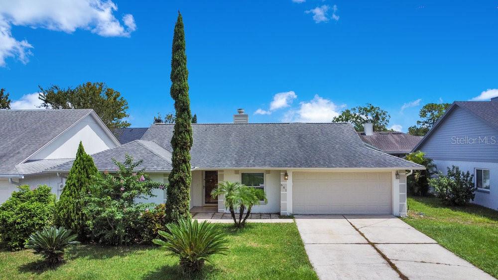 Welcome to this spacious 4 bedroom, 3 full bath, swimming pool and spa home in the heart of Lake Mary! BRAND NEW INTERIOR and EXTERIOR PAINT (August 2025). The layout of this home is a true split floor plan with TWO EN SUITES, giving everyone their own space. The primary bedroom has a large walk-in closet and sizable bathroom with dual sinks, garden tub, and separate shower. The living room is complete with glass shelving, a cozy wood-burning fireplace, and sliders that open up and overlook your private SCREENED-IN POOL/SPA and patio area. The separate dining room area would also make a great play area or flex space to fit all your needs. The kitchen overlooks the main family room area and has Whirlpool STAINLESS STEEL kitchen appliances, GRANITE countertops, soft-close cabinets, and built-in shelving. There is extra storage space and shelving just off the kitchen, which also includes the washer and dryer. Other updates include: NEWER AC (2021); Smart features, including a GOOGLE NEST THERMOSTAT (2022) and NEW GARAGE DOOR OPENER with MyQ Smart Control (2025); TESLA EV CHARGER in garage (2023); and HURRICANE WINDOWS/DOORS (2018). The home has also been RE-PLUMBED (2012). Roof was installed in 2015. The outside backyard area is great for relaxing or entertaining! Easy to maintain yard and FULLY FENCED-IN (installed 2023) for added privacy. Freshly painted pool deck and NEW POOL PUMP (August 2025). Zoned for TOP-RATED Seminole County schools, including Lake Mary Elementary, Greenwood Lakes Middle, and Lake Mary High, with the high school right around the corner and the middle school right across the street from this neighborhood! Conveniently located with easy access to the Seminole County Public Library, Top Golf, YMCA and other fitness centers, grocery stores, endless shopping, restaurants, walking trials, and major highways, such as I-4 and SR 417. If you're looking to live in the middle of it all, but still want to be tucked away, this home is for you! Schedule a private showing today! ***VIRTUAL TOUR AVAILABLE***