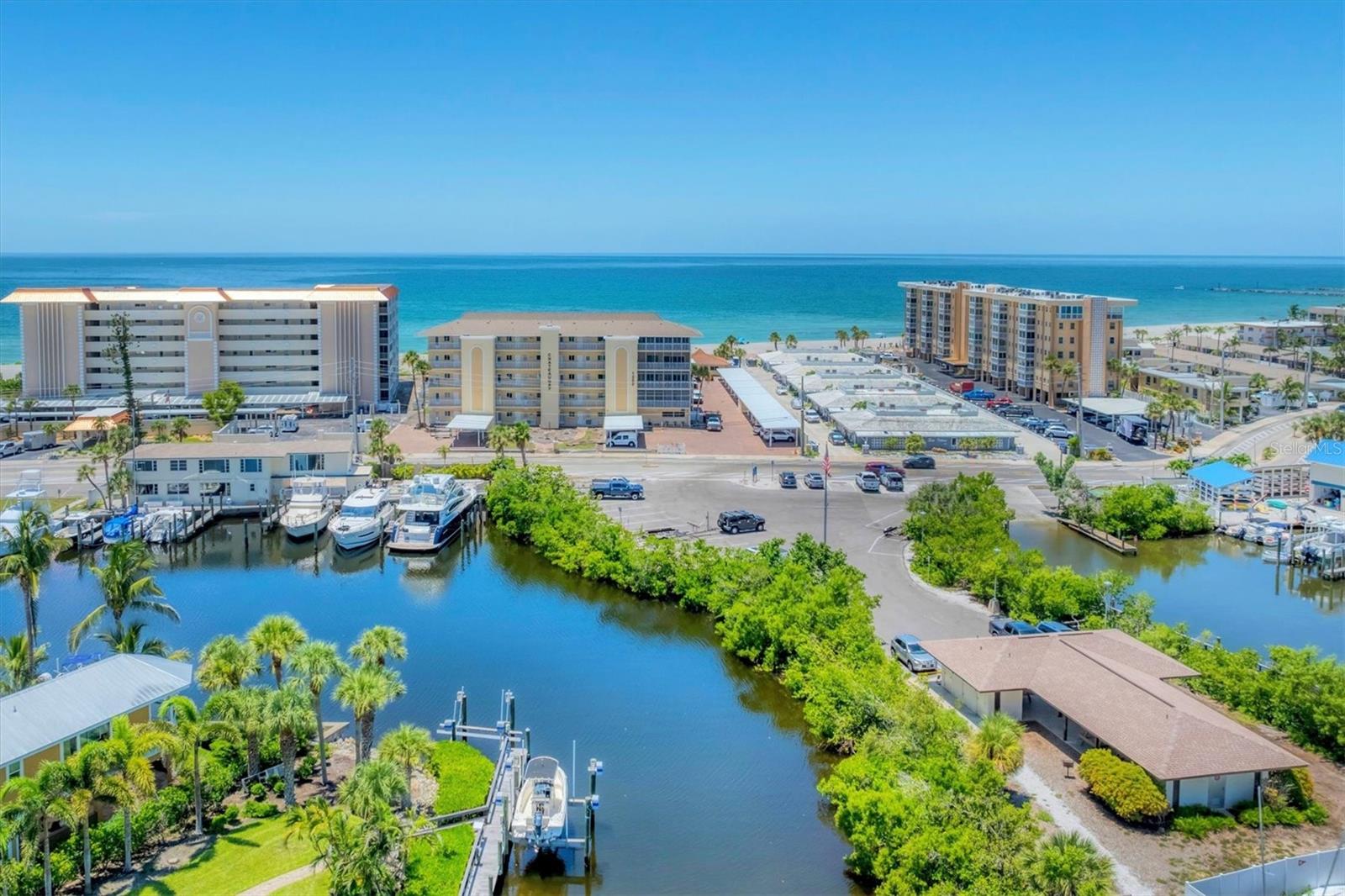 This property is ready for your personal touch. The views are fantastic as you gaze out over the Gulf, breath in the fresh sea air and maybe catch a dolphin family frolicking in the surf. This two-bedroom, two-bathroom condo has a nearby designated parking space in addition to ample guest parking. The convenience of the downstairs storage area for your beach items will help keep the sand out of your unit. Chateaugay is a wonderful community with social activities on holidays and cocktails at sunset, book and card clubs, potluck dinners and food trucks during the season. Or you can simply enjoy the heated pool, green space, and private beach access. You may enjoy the recently upgraded parking areas with attractive brick pavers and newer carports. The pool was completely redone in 2025, along with a new expanded pool surround and patio. The entire complex had hurricane impact windows and sliders installed as well as new front doors to each unit. The entire complex will be painted this fall and new landscaping is on the way! Buy into this great complex before the prices go up this coming season! This condo is a short walk to Crow's Nest Restaurant, Venice Yacht Club, Freedom Boat Club, and Higel Marine Park and an easy bike ride to all things downtown!