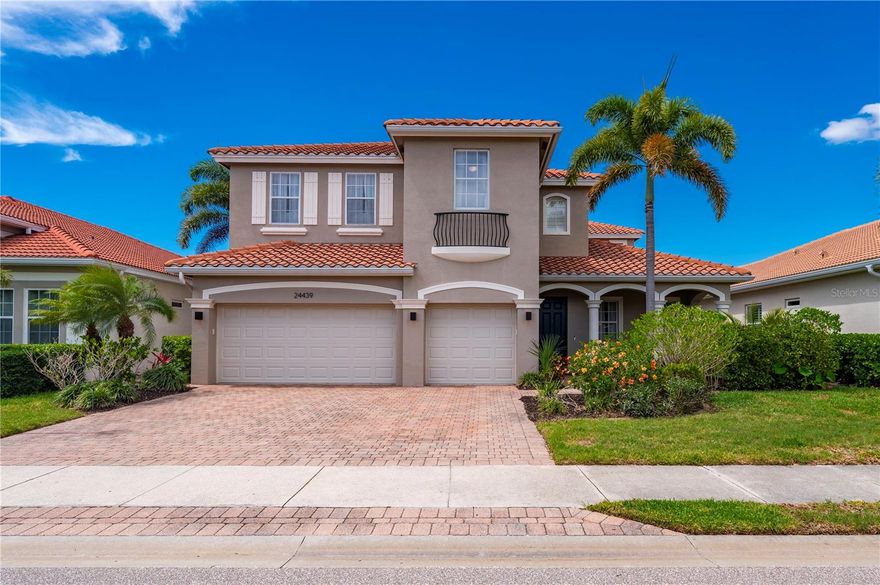 There’s a certain ease to life in this 5 bedroom, 4.5 bath home, where over 4,000 square feet in the gated River Club community blend elegance, comfort, and thoughtful design. From the moment you arrive along the paver driveway, the home signals that custom details matter. As you step inside, the foyer reveals a sweeping staircase that rises gracefully, flanked by arched openings, warm light fixtures, and an accented wood ceiling. The front room offers a quiet retreat for morning coffee, reading, or a home office. Across the hall, the dining room is ready for gatherings, with a chandelier casting a warm glow over dinners that linger past dessert. The heart of the home is the kitchen, where style and function meet effortlessly. Two-toned cabinetry frames a waterfall quartz island with soft-close cabinets and full quartz backsplash, accented by recessed LED lights and pendant lighting. Abundant cabinetry, a walk-in pantry, ship-lap bar, and stainless steel appliances, including a new LG WiFi refrigerator with craft ice maker, LG Range/Oven range, microwave, dishwasher, and wine cooler, make every meal an occasion. The island anchors the space, creating a natural gathering spot as the kitchen flows seamlessly into the family room. A first-floor guest bedroom with ensuite bath provides privacy, while the laundry room with LG WiFi washer and dryer and utility sink keeps daily tasks effortless. The powder room has been thoughtfully updated. Upstairs, a loft-style sitting area offers a quiet pause before retreating to the bedrooms. Arched hallways keep the spaces open, while luxury carpet adds warmth. Each secondary bedroom includes walk-in closets, and two have en-suite baths. All bathrooms have been updated with granite countertops, Moen faucets, and Kohler toilets. The primary suite is a sanctuary, featuring LED recessed lighting, floating shelves, custom white cabinetry with granite countertops, and a wine cooler. The spa-like bathroom includes a jetted tub, frameless glass shower, dual vanities with granite tops, and luxury vinyl plank flooring. Outside, the screened porch frames lake views for relaxing mornings or serene evenings while mature landscaping provides privacy. Additional updates include epoxy floors in the three-car garage with new doors and openers, hurricane shutters, interior and exterior paint, updated hardware, replaced outlets and switches, window treatment hardware throughout, ADT security system with two control panels, LG ThinQ Smart Home, Hunter Apex ceiling fans, and two new 20 SEER air conditioning units with whole-home purification. Within the gated River Club community, residents enjoy a pool, clubhouse, fitness center, and playground in a quiet, well-maintained setting. Convenient to downtown Punta Gorda, I-75, US 41, Punta Gorda Airport, and Gulf beaches, this home balances retreat and connectivity. For those seeking luxury homes in Punta Gorda, Florida or gated community living, this residence offers a rare and refined lifestyle ready to be lived.