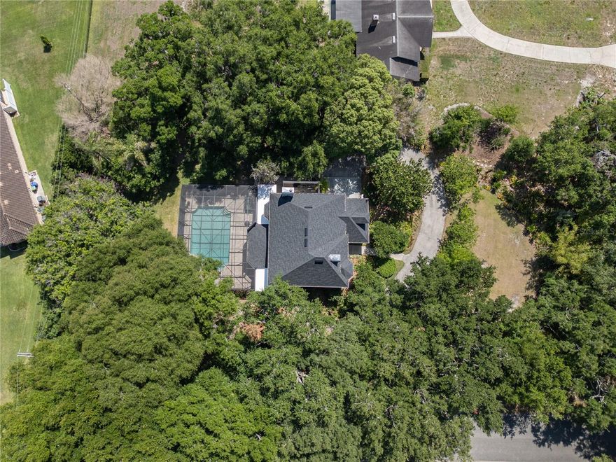 This is a must see!!! Offering four bedrooms and three and one half baths, this home sits on a beautifully landscaped, estate-sized 1 acre lot! The floor plan is flexible and allows for multiple entertaining options. The kitchen is a cook's dream with an abundance of wood cabinetry, expansive granite counters, a huge center island and built in appliances. It is light and bright and open to the breakfast area and family room, which have sweeping views across the pool and out to Lake Butler. All bedrooms are on the second floor and do not share walls, offering privacy for all of the occupants. The primary bedroom is large and even has space for a sitting area and all three upstairs bathrooms have been upgraded. Both the pool and enclosure are over-sized and have gorgeous views of Lake Butler. And there is still plenty of surrounding yard space. The house was re-piped, the pool enclosure screens and the roof were just replaced! Kelso on Lake Butler is one of the most sought-after, and little known. communities in Windermere. The street is a cul de sac, so there is no through traffic! This home will exceed your expectations, and the private community boat dock is just the icing on the cake!!!
