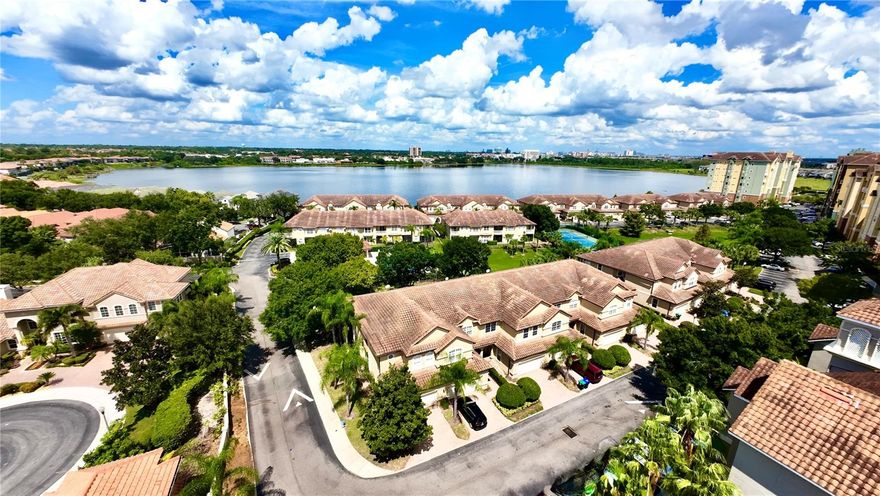 Welcome to the Distinguished, lakefront community of Vizcaya in the heart of Dr. Phillips — a 24-hour guard-gated neighborhood renowned for its luxury lifestyle, proximity to Orlando’s famed Restaurant Row, and access to top-rated schools.

This exceptional end-unit townhome with a captivating pool view is a rare find. The open-concept first floor offers a welcoming living and dining area seamlessly connected to a chef’s kitchen with high-end appliances, a center island, and convenient pass-through for easy entertaining. Sliding patio doors open to a screened lanai, extending your living space into a tranquil outdoor retreat. An attached two-car garage and adjacent laundry room add everyday convenience.

Upstairs, the owner’s suite is set apart by a loft-style flex space for privacy. It features dual custom closets, a spa-inspired en-suite bath, and a private balcony. Two additional bedrooms share a Jack-and-Jill bath, ensuring comfort and functionality. Recent updates include a new hot water heater (2022) and HVAC system (2019).

Vizcaya’s outstanding amenities include a clubhouse overlooking Big Sand Lake, a fully equipped fitness center, pickleball and tennis courts, two sparkling pools, a playground, and a dog park. The HOA covers roof, exterior, and landscaping maintenance, providing peace of mind and a truly turnkey lifestyle.

Centrally located near world-class attractions such as All Disney Parks, Universal Studios , and the wonderful new Epic Universe theme parks, and premier golf courses — this home offers the perfect balance of elegance, convenience, and community living. Don’t miss your chance to call Vizcaya home!