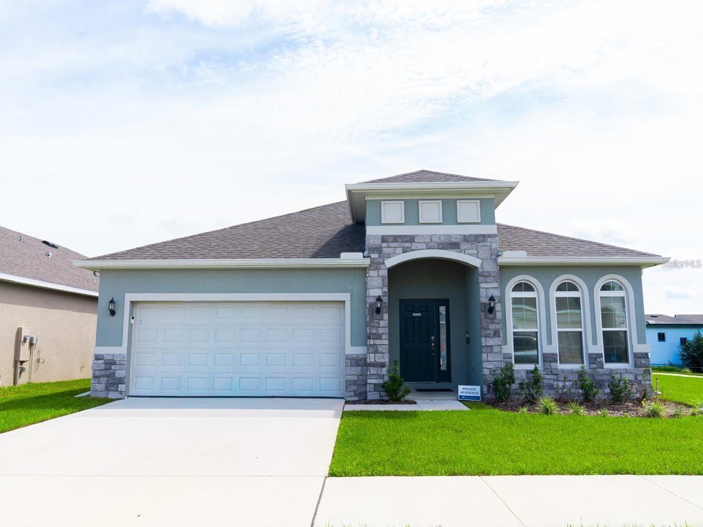 Photo of 445 Silver Palm Drive, Haines City, FL 33844 (MLS # S5160503)