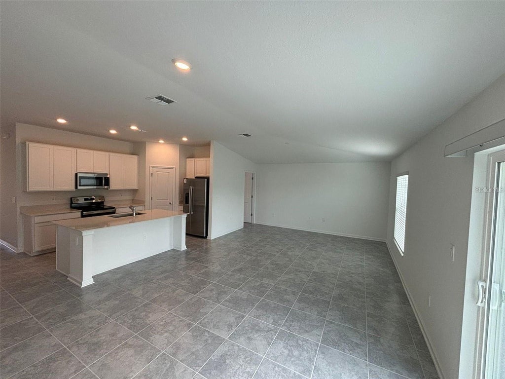 Photo of 828 Daring Drive, Davenport, FL 33837 (MLS # S5156869)