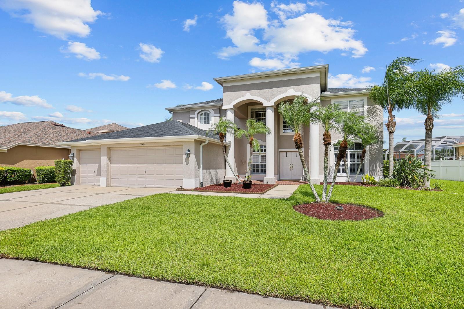Under contract-accepting backup offers. Welcome to this stunning executive home nestled in a gated, guard-monitored golf course community of Turnberry at the Eagles in beautiful Odessa, Florida. Offering a perfect blend of elegance, comfort, and function, this spacious residence features 5 bedrooms, 3 full bathrooms, and over 3,200 square feet of thoughtfully designed living space.
As you enter through the front door, you’re greeted by a grand foyer with soaring ceilings and a striking dual staircase—one ascending from the entry hall and the other providing convenient access from the kitchen, creating an ideal flow for both everyday living and entertaining. The formal living and dining rooms are positioned at the front of the home, offering an elegant space for hosting guests or holiday gatherings.
Toward the back of the home, you’ll find an expansive family room with pocket sliding glass doors that open to a screened-in lanai and resort-style pool and spa, framed by beautiful brick pavers and a covered lounging area—your own private oasis perfect for year-round relaxation and entertaining.
The kitchen is a chef’s delight, boasting a large center island, full appliance package (all replaced in 2016), updated flooring, and an abundance of cabinetry and counter space. A generously sized dinette with sliding glass doors opens to the lanai, providing the perfect space for casual dining with a view of the pool.
Upstairs, a spacious loft/flex area offers endless possibilities—whether you need a game room, home office, or secondary living space. The well-planned split-bedroom layout enhances privacy and flexibility. The luxurious primary suite features dual walk-in closets and a beautifully remodeled en-suite bathroom, complete with a soaking tub, large step-in shower, private water closet with a bidet, and updated fixtures. Bedrooms 2, 3, and 4 are located upstairs and share a full bathroom, while Bedroom 5 is conveniently located on the first floor—ideal for guests or multi-generational living—and is adjacent to the third full bath, that has direct access to the pool.
This home is as functional as it is beautiful, with a 3-car garage and a long list of valuable upgrades: a new roof in January 2021, new hot water heater in 2019, one of the A/C systems replaced in 2020, and fresh interior and exterior paint completed in July 2020. All bathrooms were remodeled in 2016, and light fixtures throughout the home have been upgraded to energy-efficient LED lighting.
Located near top-rated schools and just minutes from a variety of shopping and dining options, this exceptional property combines the best of luxury living with a prime location. Don’t miss your opportunity to make this exquisite home your own.