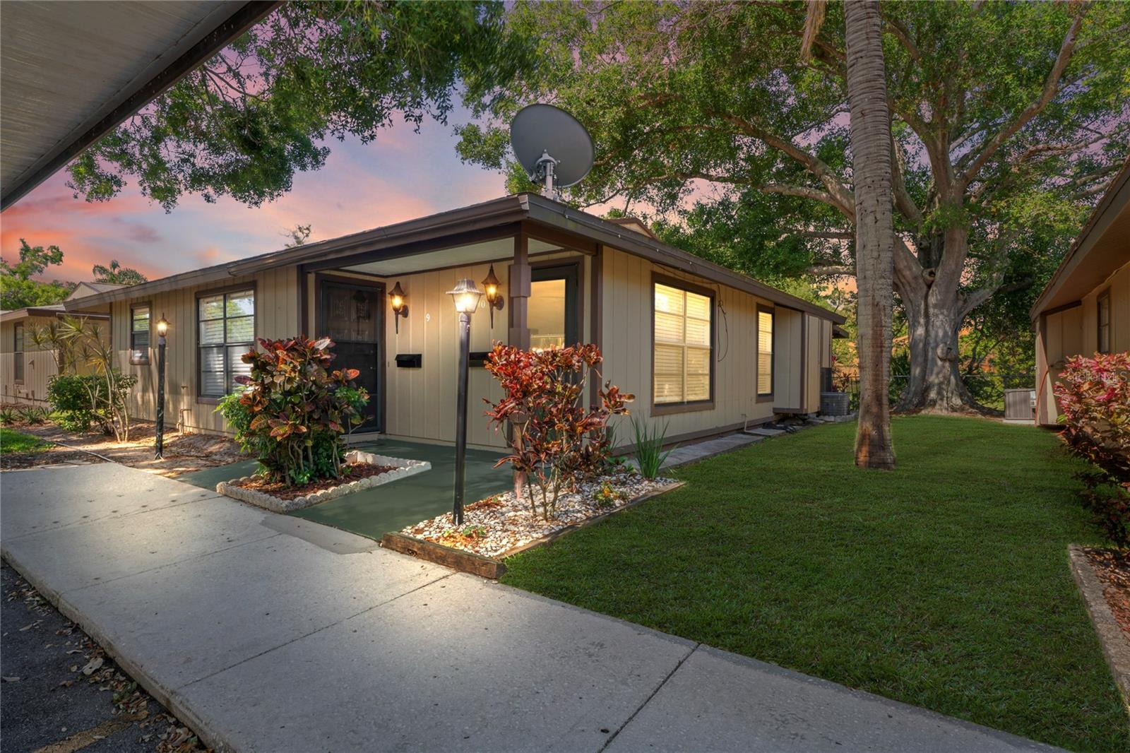 Looking for a Dunedin villa in a small community? Clean cute one bedroom, one bath with a large, enclosed patio overlooking nature views of the pond & garden. Freshly painted, Stainless-steel appliances, tub shower combo and a covered carport in front of the unit. Washer dryer combo in the kitchen. Walk to the shopping center, bank, restaurants and discover Dunedin. Just minutes from Downtown Dunedin.