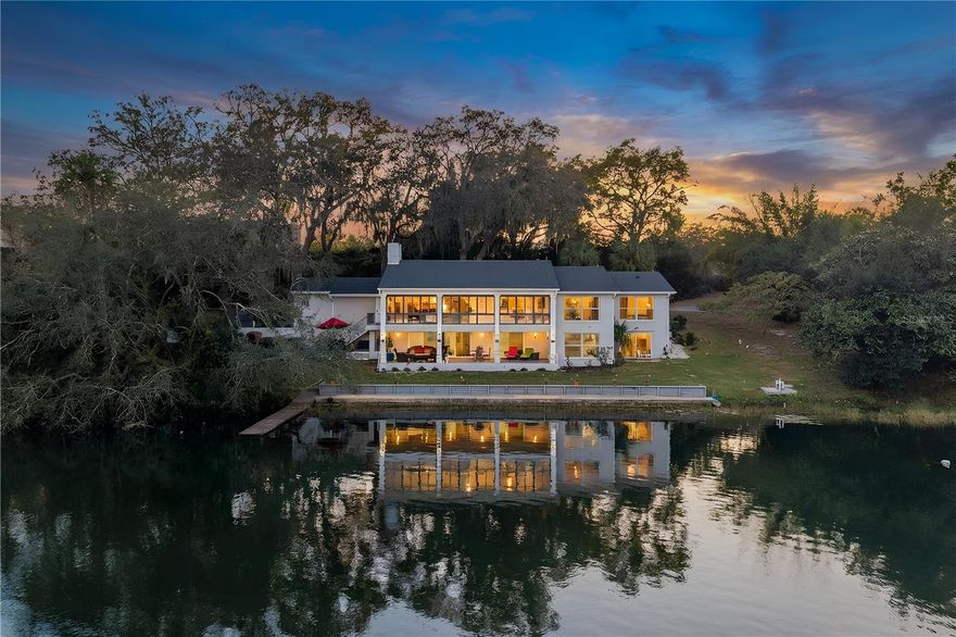 Love where you live. Completely renovated (2025) lakefront living on the private, skiable waters of Lake Louise - just minutes from downtown Mount Dora’s charming shops, dining, and year-round events, yet tucked away in your own peaceful waterfront sanctuary.

Situated on nearly an acre with mature landscaping, this thoughtfully updated custom home offers expansive water views from nearly every room. Each morning, the sun rises over the lake, creating a breathtaking backdrop to start your day from the Florida room, living areas, and primary suite.

The main level features oversized 24x48 porcelain tile throughout and walls of floor to ceiling windows that fill the home with natural light. The fully remodeled kitchen showcases porcelain countertops and backsplash, new cabinetry, high-end Samsung appliances, a premium LG dishwasher, and a large walk-in pantry.

The primary suite has been completely renovated and includes a spacious walk-in closet, dual sinks, and a beautifully designed walk-in shower. A secondary bedroom on the main level also features a walk-in closet. The home also boasts an office/den on the main floor.

The air-conditioned Florida room spans the rear of the home with floor-to-ceiling lake views, creating seamless indoor-outdoor living and one of the most captivating spaces in the home.

The finished lower level offers luxury vinyl plank flooring, an expansive flex space perfect for a game room, media room, or gym, along with two bedrooms with lake views and a bathroom featuring a tub/shower combination.

Additional highlights include: • 2025 roof • Recently redone concrete seawall • Wood dock • Outdoor kitchen • Wood-burning fireplace • Indoor laundry • Two-car garage with extra storage and attic space • 4-year-old shed • Stunning magnolia tree & Avocado tree •

Lake Louise is a private 19-acre skiable lake ideal for boating, paddleboarding or kayaking. Pool plans? 
Infinity pool overlooking the water can be added and the sellers have an estimate ready. Homes like this rarely become available. Contact me today for a private showing!