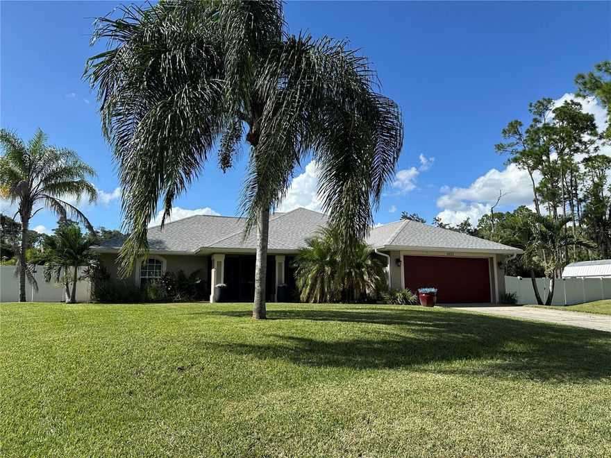 This fabulous  fresh water canal front home situated on a  HUGE fenced double lot is ready for YOU!!  Enjoy spreading out just under 1700 sq ft of living space offering 3 bedrooms, 2 completely UPDATED bathrooms and 2 car garage. This home features a Brand New Roof (1/8/2026 Roof Permit-Closed), Heated Salt Water Pool accented with brick paver deck, new plumbing in 2024, tile flooring throughout, tiled and screened lanai, and did we mention the fenced double lot for the ultimate privacy!  As you enter the home through the double door entry you are greeted by the expansive great room with soaring ceilings and sliders leading out to the lanai and private back yard.  The formal dining room is light and bright offering the perfect place to enjoy a delicious meal with family and friends.  The kitchen is nicely appointed with stainless steel appliances, granite countertops, lots of cabinetry, island, breakfast bar and closet pantry. The owner’s suite highlighted with sliders leading out to the lanai, completely remodeled/ updated ensuite bath and walk in closet.  This is an ample split floor plan which provides privacy with the nice size guest bedrooms on the opposite side of the home with an updated shared bath with shower/ tub combination.  There are plenty of pluses with this home including, Tankless Water Heater,  Whole house RO system, sprinkler system, huge shed for storing all your toys and NO HOA fees! This home is conveniently located in the heart North Port, close to beaches, restaurants, shopping, and other local attractions. NOW is the time to make this wonderful home yours TODAY!!!!