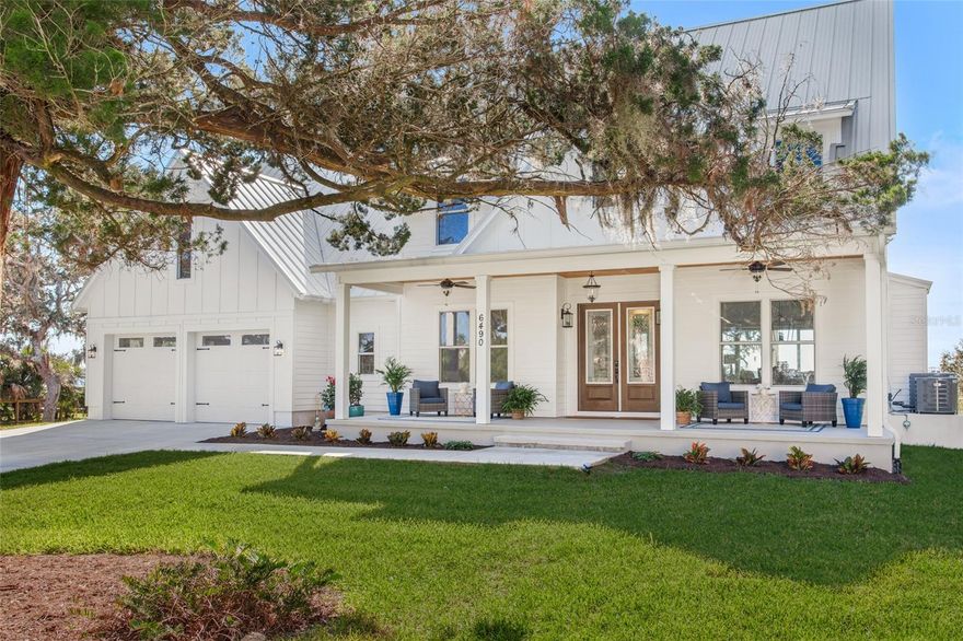 This luxurious coastal home is a true oasis, offering breathtaking views of the Intracoastal Waterway and an array of outdoor living spaces. Nestled on a 2.28-acre property, the gated 5BR/4.5BA residence boasts 150 ft of prime water frontage and private deep water dock access that can accommodate a 57' boat. Newly built, the home offers a serene retreat while still being a stone's throw away from local shops, eateries, and the beach. The home boasts three levels of expansive balconies, taking full advantage of the picturesque views and refreshing breezes. Surrounded by mature oak, cedar and palm trees, the property's wide front porch, complete with rocking chairs, invites you to slow down and soak in the beauty of your surroundings.

Inside, the open living spaces are awash with natural light, designed to enhance the stunning views. The office and dining room, which seamlessly connect with the living room and kitchen, are perfect for both daily living and entertaining. The main gathering room features a 20ft clear-story ceiling, a cozy gas fireplace, custom built-ins and a wall of sliding doors that open to a covered porch - ideal for dining al fresco. The kitchen is a chef's dream, with a blend of white and wood cabinets, creamy quartz countertops and a large central island with seating. High-end appliances include an Electrolux full refrigerator/full freezer, a 6-burner Signature Kitchen Suite range with griddle and double oven, a Bosch dishwasher, and a sink with a view that will make doing the dishes a pleasure. The kitchen also includes a walk-through Butler's pantry with custom shelving and a built-in microwave. The first floor also features a half bath for guests, a utility room, and the luxurious master suite. The master retreat is complete with a vaulted ceiling and magnificent views of the Intracoastal Waterway, while the master bathroom is a true oasis with 24x48 Italian porcelain tiles, split vanities, an oversized shower with dual shower heads, and two walk-in closets. The second floor boasts a guest bedroom with a vaulted ceiling and en-suite bathroom, a spacious 18x12 loft-style family room with a wet bar and beverage fridge, and two additional bedrooms with a shared bath. The second-level covered porch, measuring 33x10, provides the perfect place to enjoy sunsets and stars, and a staircase leads to a 3rd floor 15x10 bonus room and covered balcony. The outdoor areas of this magnificent property offer plenty of opportunities for relaxation, recreation, and entertaining. With room for gardening, games, a bench swing, fire pit, cornhole, dock seating, and more, there's something for everyone. The main house features a two-car garage, and there is an additional detached garage with two parking spots and an apartment above that can be used as a mother in law suite or as you please. A circular drive connects the two structures, and there is a detached shed for extra storage. An on-demand site generator is located away from the main home and out of site. The gated entry ensures privacy, and there is a nearby public beach walkover, inviting you to enjoy the sand and surf…see you there.