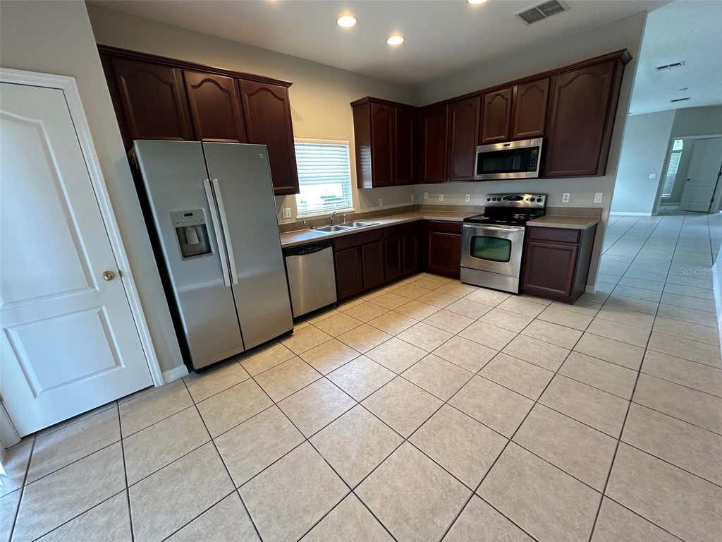 Photo of 7815 Rex Hill Trail, Orlando, FL 32818 (MLS # O6434563)