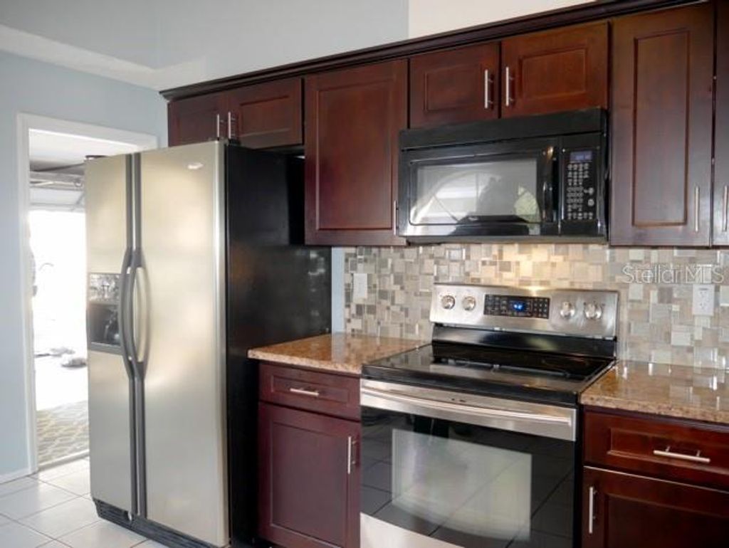 Photo of 4611 Bridgeton Lane, Orlando, FL 32817 (MLS # O6395346)