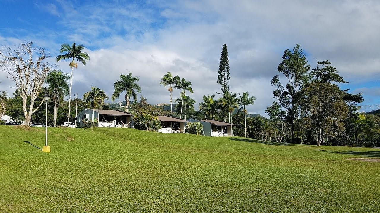 Embrace Tranquility and Opportunity at Parador Villas Sotomayor, Adjuntas
Discover the allure of Villa Sotomayor Lodge, a celebrated eco-retreat nestled in the heart of Puerto Rico's majestic mountains in Adjuntas. This unique property spans 13 lush acres, offering a blend of serenity, culture, and nature.
Features at a Glance:
Accommodations: 35 enchanting cabins provide a cozy, intimate getaway amidst natural splendor.
Fitness: Gym ensures guests maintain wellness routines in a motivating environment.
Dining: Two distinguished restaurants boast 20 years of exceptional service.
Recreation: A vast, picturesque pool area invites relaxation and leisure, set against the stunning mountainous landscape.
Equestrian Facilities: Equestrian enthusiasts will revel in the extensive land, complete with horse stables.
Adjuntas, a treasure in the mountains, is renowned for its peaceful ambiance, cultural richness, and the iconic "Sleeping Giant" view. Villa Sotomayor Lodge isn't just a property; it's a lifestyle—a sanctuary for those seeking a tranquil retreat or the excitement of eco-tourism adventures.
For the visionary buyer or investor: This is more than a purchase; it’s an invitation to continue a legacy of hospitality and a promise of a lifestyle in harmony with nature.
Begin your adventure in Puerto Rico with this unparalleled property offering. A haven for relaxation and a prime opportunity for business awaits.