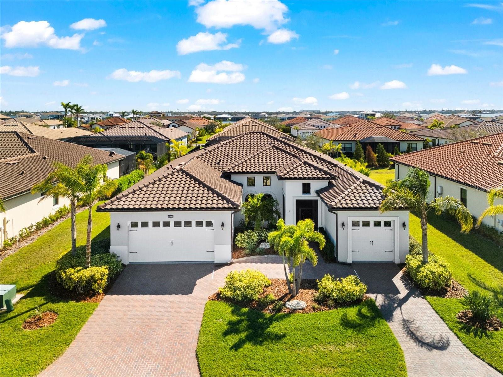 Calling all boaters to paradise, in Sanctuary Cove, a highly sought-after gated luxury boating community nestled along the Manatee River. This is the home you have been waiting for, with all the upgrades and features you could want! 4 bedrooms, 3 baths, a 3-car garage, heated salt water pool & a deeded boat slip w/ a 16k lift that will fit up to a 35ft boat. Easily access the Intracoastal Waterway & boat to St Pete’s, Anna Maria, Sarasota etc….
This meticulously maintained home offers the best of maintenance-free living, has amazing curb appeal & is packed with upgrades. Situated on an 80’ wide lot featuring a beautiful barrel tile roof w/ clipped gables, full gutters, built in pest system, soffits trimmed in crown moulding, stucco finish, bronze impact windows, split 3 car garage plan w/ 8’ tall impact doors (fits a full size truck), screened entry w/ 8’ door & side lights, & mature landscaping that’s well light at night!
This expansive split floor plan provides a seamless flow, is bright / open, & perfect for entertaining, with touches of luxury throughout. Featuring a grand 13' entry, 10-foot ceilings, 8-foot doors, fully remote-controlled LED lighting package, ceiling fans, two on demand gas water heaters, window treatments & shutters, w/ hardwood floors throughout & tile in the bathrooms & laundry room. Crown moulding and tray ceilings elevate the living room, dining room and primary bedroom, adding a touch of detail. The large primary suite will easily fit your king size bed, has a California style walk in closet, full 5 pc ensuite with a soaking tub & a walk in shower.
The kitchen is very well-appointed w/ an abundance of cabinets, quartz tops, full tile backsplash, SS profile appliances - a 42” side by side fridge / freezer, gas cooktop, wall oven & a full bar area with a built-in wine fridge. It’s perfectly situated with a very spacious formal dining room on one side, seating at the island + an eating space & it’s overlooking the living room & out to the covered lanai.
The 8’ tall sliders provide easy / seamless access to the fully caged lanai & more than doubles your living area. Enjoy the SW Florida lifestyle year-round with your full outdoor kitchen, covered lanai fireplace, TV, heated saltwater pool, & built in gas fire pit all lit up like your own private resort!
Steps from your front door, enjoy the vibrant lifestyle Sanctuary Cove has to offer. Cruise through the neighborhood in your golf cart to access exclusive amenities, including a private clubhouse, resort-style pool and hot tub, gym, & a community beach. Boating enthusiasts will appreciate the protected freshwater harbor Located in Zone X, this home requires no flood insurance and did not flood or sustain any damage in the storms since its construction in 2020. Sanctuary Cove is a friendly, active community just minutes from shopping (Detwiler’s Market is right across the street), dining, and some of the nation’s best sugar-sand beaches. Don’t let this one get away