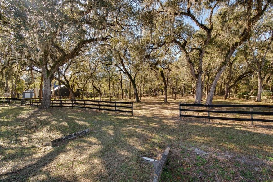Set on 2.5 acres in the equestrian community of Meadow Wood Farms, this property is full of opportunity for those ready to bring their vision to life. Zoned A-1, the land is beautifully shaded by mature oak trees and already features board-and-wire perimeter fencing. 
Whether you choose to hold the land for your horses or design and build your dream home, the possibilities are plentiful. With its zoning, the property is also well-suited for a mini-farm, bring your animals or your ideas for growing your own food.
Ideally located in Ocala’s highly desirable Horse Country, you’ll enjoy convenient access to the World Equestrian Center and HITS, along with nearby feed and tack shops, veterinarians, and other essential equine services.
If you’ve been searching for your place in the Horse Capital of the World, this property is an excellent opportunity. Please note: HOA regulations do not allow manufactured or mobile homes on this property.