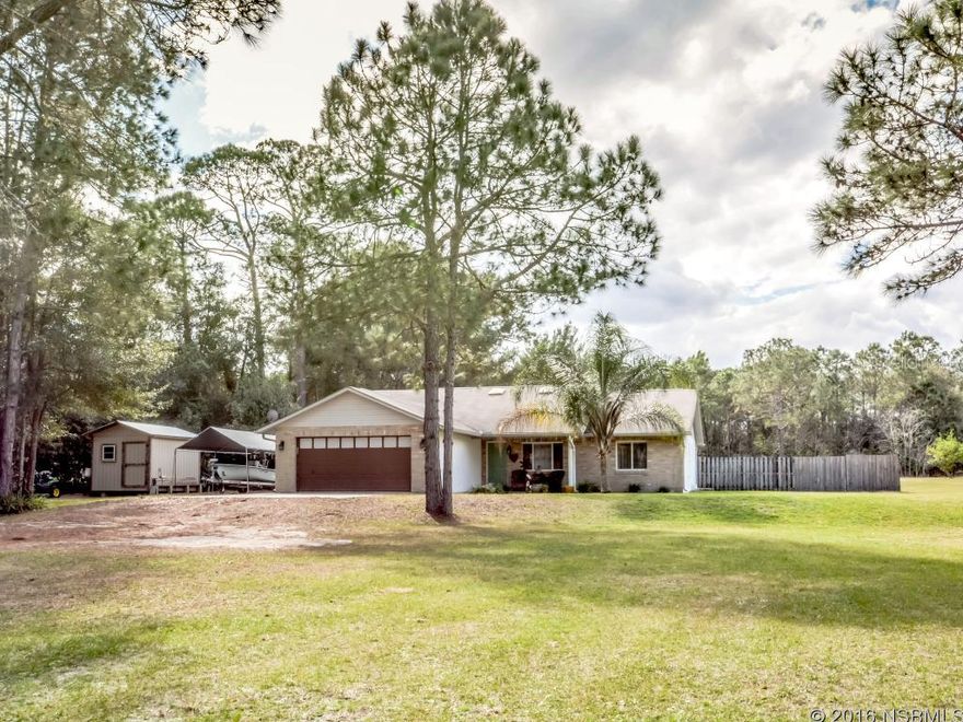 Fantastic 3 bedroom, 2 bath home in New Smyrna Beach situated  on 1.6 acres with easy access to I95, shopping,  the river and beach. Newer renovated kitchen and stainless appliances,  New laminate flooring, new A/C, new roof,  vaulted ceilings, split floor plan, family room and 2 car garage. ;Water: City