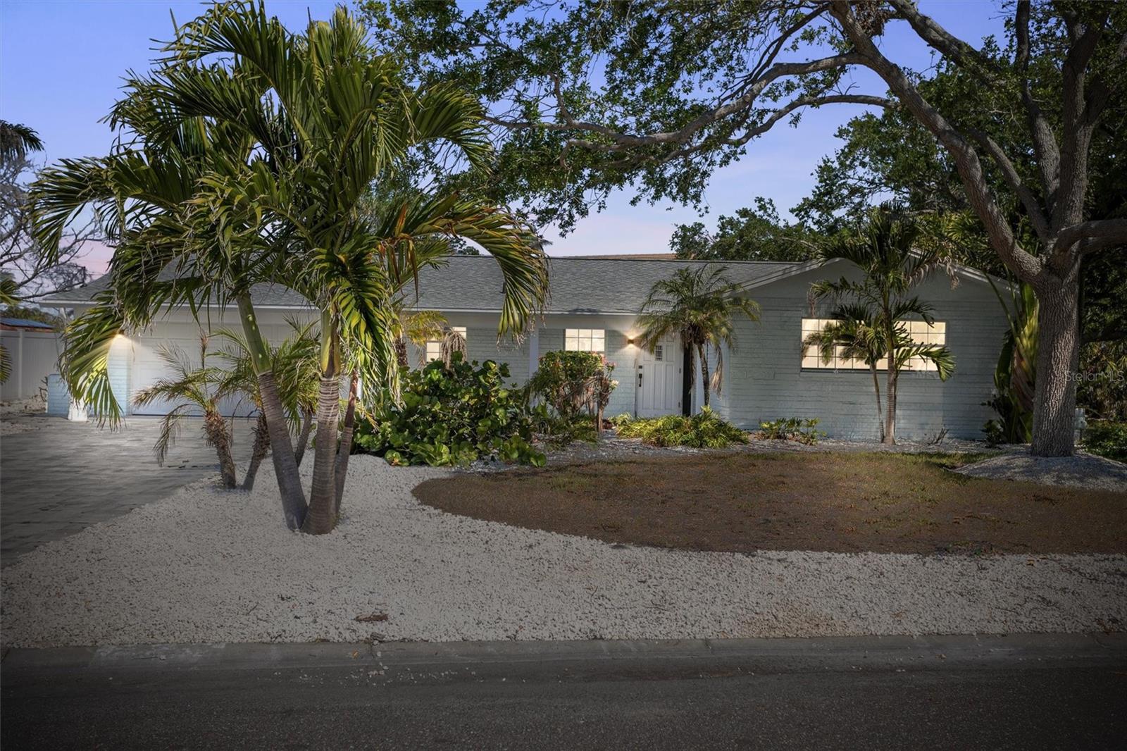 Gorgeously updated home on Prestigious Paradise Island. This beautiful fully furnished home, located on a corner lot, has been fully renovated from top to bottom, including new water resistant green board in place of drywall, new interior paint, a new kitchen, new bathrooms, updated electrical, new doors, and so much more. The beautifully landscaped fenced in yard includes a large private pergola area and is perfect for entertaining and the large side yard has two swings, perfect for those who want to bring out their inner kid. The neighborhood is conveniently located just miles to the beach, and is a surrounded by restaurants, entertainment and shopping. Home is fully furnished, including all dishware, pots, pans, towels, and sheets.
