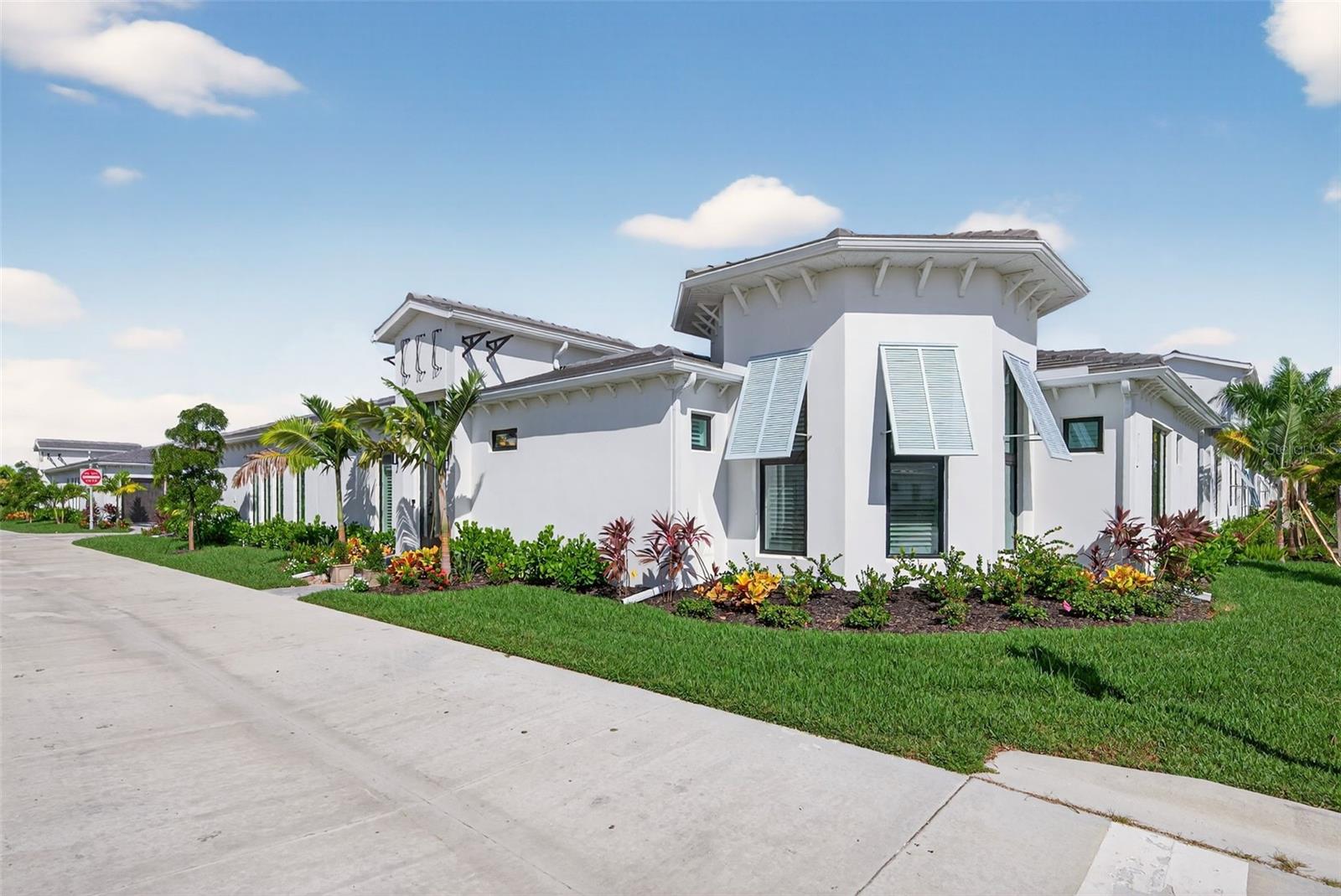 Step behind the gates of Aqua Lagoon, Bradenton’s premier waterfront community celebrated by the Parade of Homes and home to a 4-acre crystalline lagoon and private beach.
This beautifully built, one-story Cat Claw model offers a rare opportunity to own a thoughtfully designed home that blends modern coastal elegance with relaxed Florida living. With 3 bedrooms, 3 bathrooms, and 2,700 sq. ft. of living space, the single-level layout is both spacious and effortless, perfect for everyday comfort and entertaining.
Set on a premium lot, the home features an oversized caged pool, spa, and courtyard that create a private outdoor oasis rarely found in newer phases of the development. Inside, soaring ceilings, wide sliding doors, marble floors, designer lighting, and plantation shutters fill the home with light and airiness. The open floor plan includes formal living and dining areas, plus a stylish wet bar with beverage fridge and custom shelving.
The chef’s kitchen is appointed with high-end stainless appliances, built-in oven and microwave, gas cooktop, walk-in pantry, and a generous island. The primary suite offers a serene retreat with wood accents, patio access, a spa-inspired bath with dual vanities, walk-in shower, soaking tub, and custom closet. Two additional bedrooms, including a flexible office/den option, provide comfort and versatility. The 2-car garage with alley access adds built-in cabinetry and overhead storage.
At Aqua Lagoon, the sparkling 4-acre lagoon pool and private beach are the centerpiece of community life, providing a resort-style atmosphere just minutes from Anna Maria Island, IMG Academy, SRQ Airport, UTC, and St. Armand’s Circle.
Skip the wait for new construction — your move-in ready, one-story Florida paradise is here.