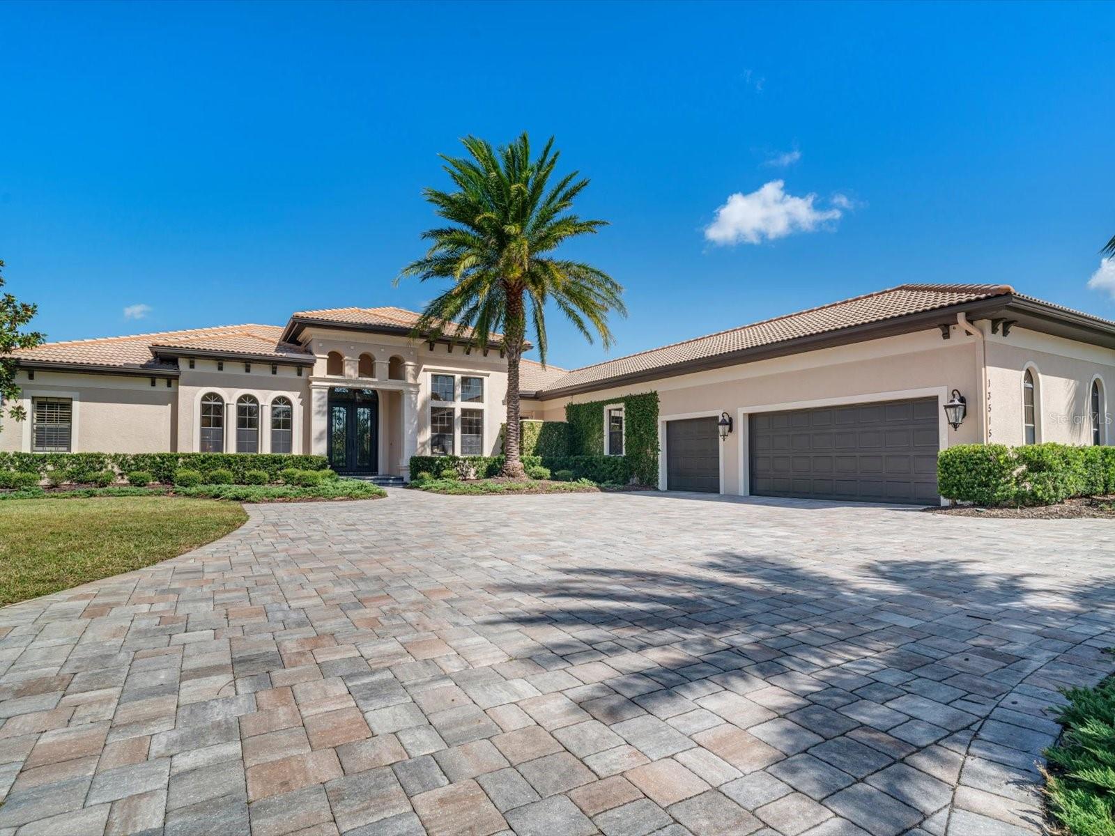 **THIS PROPERTY QUALIFIES FOR A 1% LENDER INCENTIVE IF USING PREFERRED LENDER. INQUIRE FOR MORE DETAILS.** Nestled within the gates of Lakewood Ranch Country Club, this stunning 5-bedroom, 5 full and 2 half-bath home is an entertainer's dream, showcasing a stunning outdoor space that redefines sophistication. Set on a generous three-quarter acre, fully fenced lot, this home ensures peace of mind with features like a whole-home generator, impact glass doors and windows throughout, and an advanced water filtration and air filter system.
The outdoor entertainment area serves as the centerpiece of this home, highlighting a luxurious lifestyle centered around an oversized heated saltwater pool and spa. Experience true outdoor living with multiple spaces designed for relaxation and entertaining. The fully equipped outdoor kitchen elevates dining outside, featuring a top-of-the-line TEC gas grill, dual sinks, drink coolers, and a spacious island perfect for intimate dinners or larger gatherings. A convenient pool bath, complete with a stackable washer and dryer and mini-split AC, ensures effortless enjoyment of poolside living.
Step through the grand French doors into a thoughtfully designed interior, where travertine tile flooring flows seamlessly through the main living areas, complemented by rich hardwood floors in the bedrooms and bonus spaces. High ceilings adorned with crown molding enhance the inviting atmosphere, while the formal living and dining rooms provide the perfect backdrop for unforgettable gatherings.
The family room and chef’s kitchen create a warm and inviting environment, featuring granite countertops, premium stainless steel appliances—including a gas cooktop by Wolf, a Sub-Zero refrigerator, and a wine fridge—and a spacious island with a prep sink. Adjacent to the kitchen, an inviting nook with an aquarium window enhances the ambiance, while pocket corner sliding glass doors in the family room provide an effortless transition to outdoor living.
Retreat to the luxurious primary suite, where comfort reigns. The ensuite bathroom features a soaking tub, a spacious shower with dual shower heads, and dual vanities that provide ample space for your daily routine. Plantation shutters add a touch of elegance and privacy. Four additional spacious bedrooms await, with two featuring private ensuites and two sharing a thoughtfully designed Jack-and-Jill bathroom, ensuring comfort and privacy for family and guests alike.
A dedicated office and half bath are conveniently located off the foyer, while a versatile bonus space off the family room opens to a covered outdoor area, offering endless possibilities. Embrace the vibrant lifestyle at Lakewood Ranch Golf & Country Club, where scenic views create an idyllic setting. Enjoy a wealth of outdoor activities with extensive biking and walking trails, along with numerous top-rated golf courses that cater to both beginners and seasoned players. Moments away, explore the charming atmosphere of downtown Lakewood Ranch Main Street and the lively Waterside Place, featuring weekly farmers' markets and exciting ranch night festivities.
With convenient access to I-75 and the UTC shopping district, everything you need is at your fingertips. Experience the best of Lakewood Ranch living!