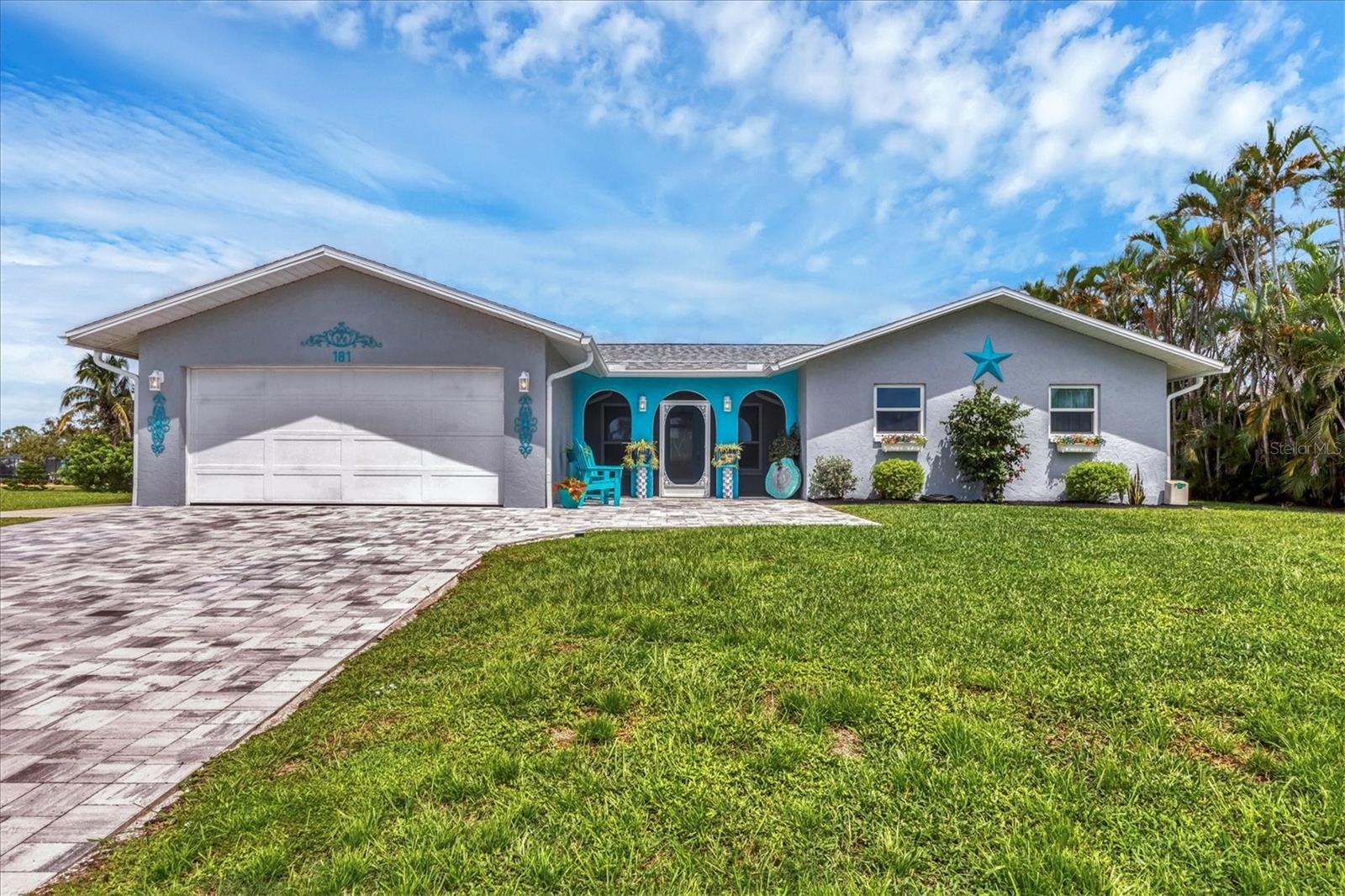 Discover the perfect Florida retreat in this charming and extensively updated home, located on a quiet street in the heart of Rotonda West. Here, you'll find a delightful blend of classic Florida charm and modern amenities. As you arrive, an attractive paver driveway and a cozy screened front porch invite you to explore further. Inside, you'll appreciate the meticulous attention to detail and the numerous updates that have been made throughout the home. The heart of the house is a beautifully designed kitchen, featuring stainless steel appliances, attractive Shaker-style cabinetry (with convenient pull-outs in several cabinets), a large prep island, and stunning Quartzite countertops imported from Brazil. The open-concept layout integrates the kitchen, dining, and living areas, making it an ideal setting for entertaining family and friends. A built-in dry bar (currently in use as a coffee station) in the dining room adds an extra touch of convenience. Sliders lead you to the outdoor entertaining space, where you can relax on the covered patio and enjoy the serene views of the canal. The home's eye-appealing, fresh coastal color palette reflects the tranquil yet vibrant hues of nearby beaches, creating a pleasing atmosphere throughout. The primary suite, along with its adjoining bath, offers a spa-like retreat—perfect for unwinding after a day at the beach. The fully updated ensuite bathroom showcases ADA ACCESSIBILITY FEATURES, including a Roman shower with beautiful subway tile (roll-in) and a 36" entry door. Two additional spacious bedrooms were designed to accommodate guests in comfort, along with a renovated shared bathroom featuring a tub/shower combination with a tile surround and a stylish vanity with a beautiful stone countertop. ADDITIONAL NOTABLE UPDATES INCLUDE A NEW ROOF (with third nail and tie-downs added), HVAC UNIT (with a Halo LED whole-home air purification system), PGT HURRICANE IMPACT-RESISTANT WINDOWS AND DOORS, 'WOOD-PLANK' PORCELAIN TILE THROUGHOUT THE HOME, UPDATED LIGHTING FIXTURES AND FANS, FRESH INTERIOR AND EXTERIOR PAINT, AN IMPACT RESISTANT GARAGE DOOR, WATER HEATER, NEW INTERIOR DOORS AND TRIM, AND AN EPOXY FINISH ON THE GARAGE FLOOR. Rotonda West is a quiet, friendly neighborhood within a short drive to the pristine Gulf beaches of Boca Grande and Englewood. There are world-class fishing and boating opportunities, eclectic dining establishments, and shopping venues nearby. Golf enthusiasts will appreciate the community's five golf courses. Call today to schedule a private showing if you're searching for a distinguished, updated home with numerous upgrades.