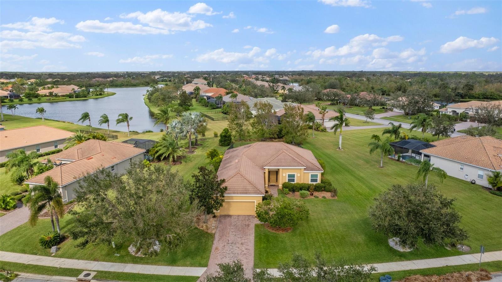 Nestled on a spacious lot just shy of half an acre, this meticulously maintained 3-bedroom, 2-bathroom home with a versatile den was thoughtfully built by Medallion Homes in 2010. The open-concept floor plan and soaring ceilings create a bright and airy atmosphere, making you feel instantly at home.
The heart of this home is the stunning kitchen, featuring elegant wood cabinetry, sleek quartz countertops, and a suite of upgraded stainless steel appliances. Recent updates include a new refrigerator (2024), a microwave (2019), a range and dishwasher (2016), and a disposal (2020)—offering both style and functionality for the discerning chef.
The home boasts a unique oversized garage, originally designed to accommodate four cars. Currently configured as a three-car garage with abundant extra storage, the home now includes a custom walk-in pantry (created by converting the former laundry room) and a newly built laundry area. This creative layout offers unparalleled convenience and storage options.
Additional upgrades include a newer air conditioning system (2021) and a water heater replacement (2016). Outdoors, the home features a beautiful paver brick driveway and extended patio. The screened-in lanai offers a perfect spot for outdoor relaxation, while the fenced backyard provides privacy and room to roam. Beyond the fence, the expansive lot continues to offer even more space, extending past the cedar and red maples.
This home truly combines comfort, style, and practicality—don't miss your chance to make it yours!