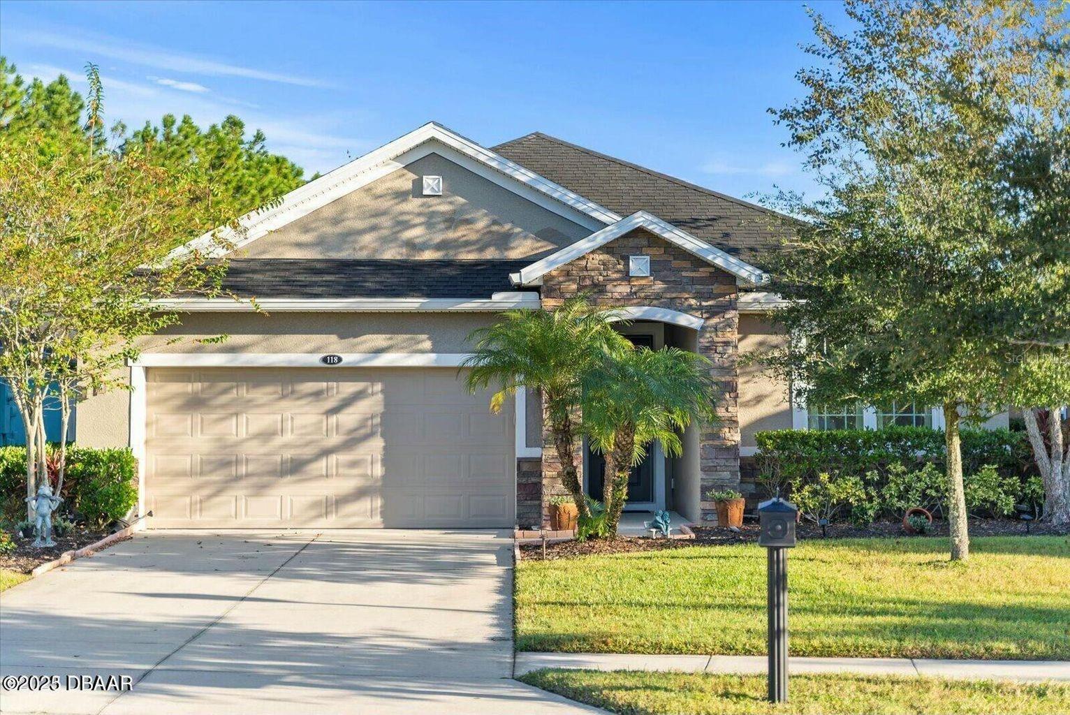 Welcome to your dream home nestled in the exclusive LPGA neighborhood, offering a harmonious blend of tranquil water views, open living spaces, and an array of modern amenities. This immaculate, fully updated with modern finishes residence is located on a quiet cul-de-sac street, ensuring the utmost in serenity and privacy. Sip your morning coffee while gazing at the serene waters, and watch the world go by in blissful tranquility. The owner's suite is a true sanctuary, featuring a generous walk-in closet and a luxurious tile shower with a jetted tub for the ultimate in relaxation. House wired for home security system. This is your private retreat, where you can unwind and rejuvenate. Fresh paint in the entire interior, lanai, and garage. Updates include: New AC unit, Epoxy on garage floor. New flooring throughout with lifetime guarantee. All ceiling fans and lighting fixtures are new. Power washing completed on the house, driveway, and sidewalks Fresh landscaping.