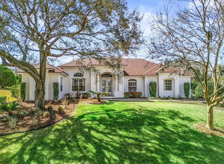 Welcome to Harbor Hills — an exclusively gated golf, tennis, and boating community nestled on the shores of Lake Griffin, offering some of the finest views in all of Central Florida.
This thoughtfully designed concrete block and stucco home features 4 bedrooms, a large office/den, and 3.5 full baths, all set on an elevated lot with a side-entry 3-car garage. Step through the double entry doors into a bright, open layout with 10' ceilings and tile flooring throughout. The great room, dining room, kitchen, and primary bedroom all enjoy beautiful views and direct access to the screened lanai and private pool/spa, surrounded by lush trees and landscaping.
The living room centers around a propane gas fireplace, perfect for cozy evenings. The spacious primary suite includes a walk-in closet with direct bath access and a generous ensuite. Secondary bedrooms are large with designer closet makeovers, and the baths are equally well-appointed.
Topped with a brand new roof and offered with no bonds to pay, this home checks every box in one of Central Florida's most sought-after multi-generational communities.