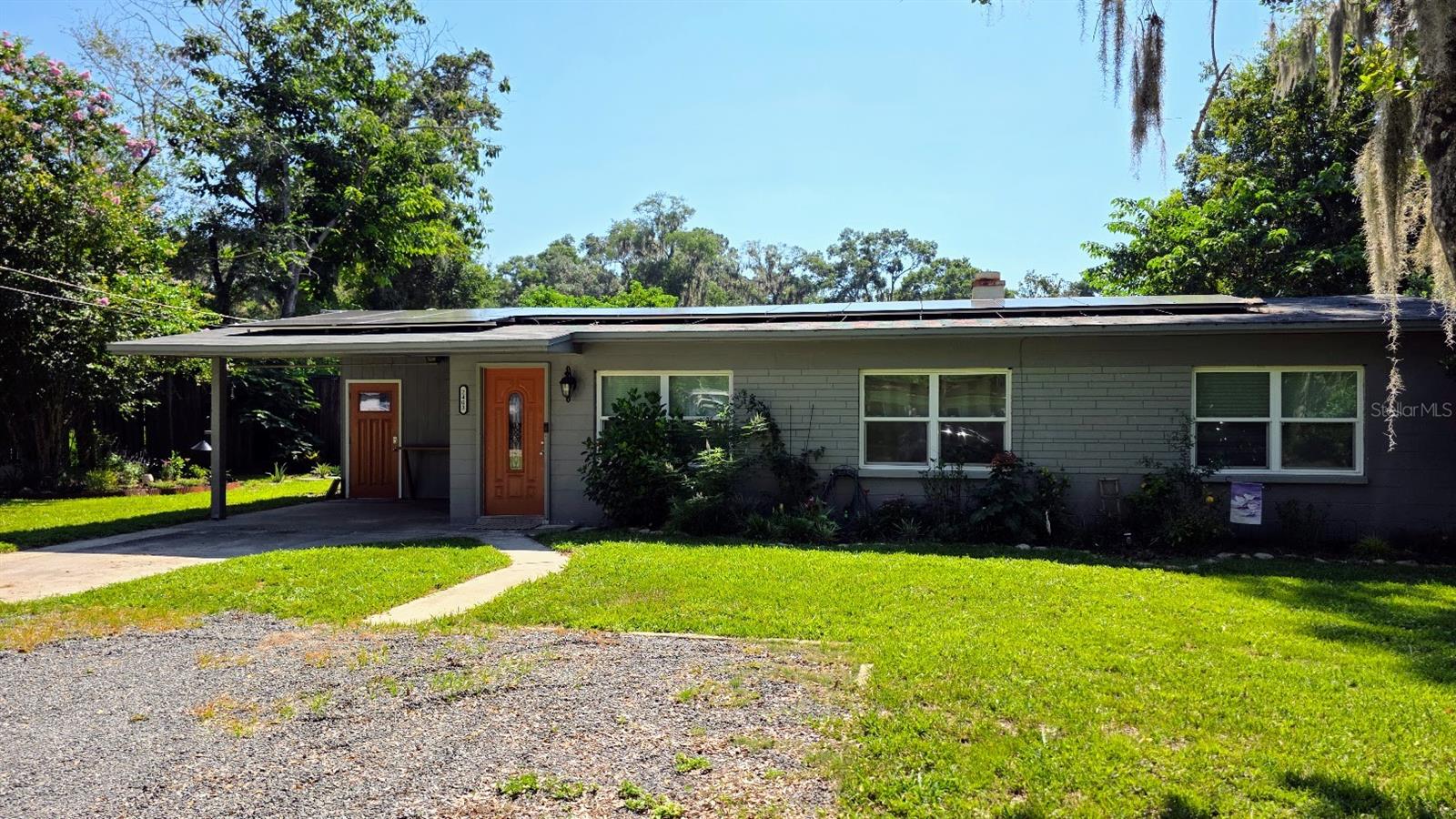 Welcome to this beautifully updated mid-century modern ranch nestled in northwest Gainesville. Thoughtfully renovated to preserve its iconic architectural charm while embracing today’s comforts, this 3-bedroom, 2-bath home seamlessly blends form and function.
Natural light floods the open-concept living space through expansive windows, highlighting original ceramic tile floors, freshly painted interior, exposed beams, and clean, timeless lines. The kitchen was renovated in 2022 and boasts granite countertops, sleek cabinetry, stainless steel appliances, and a spacious island—perfect for preparing recipes and entertaining.
Energy efficiency meets modern living with a fully-owned solar panel system installed in 2022, significantly reducing utility costs and your carbon footprint. Additional updates include all new windows 2018, new roof 2021, new HVAC 2022, new mini-split HVAC 2024, and refreshed bathrooms with designer finishes.
Enjoy Florida living at its finest in the lush, private backyard—ideal for outdoor gatherings, gardening, or simply relaxing in the shade of mature trees. Located minutes from the University of Florida, local parks, shops, and dining, this home offers both tranquility and convenience.
Don't miss this rare opportunity to own a move-in-ready modern classic with sustainable features in the heart of Gainesville.