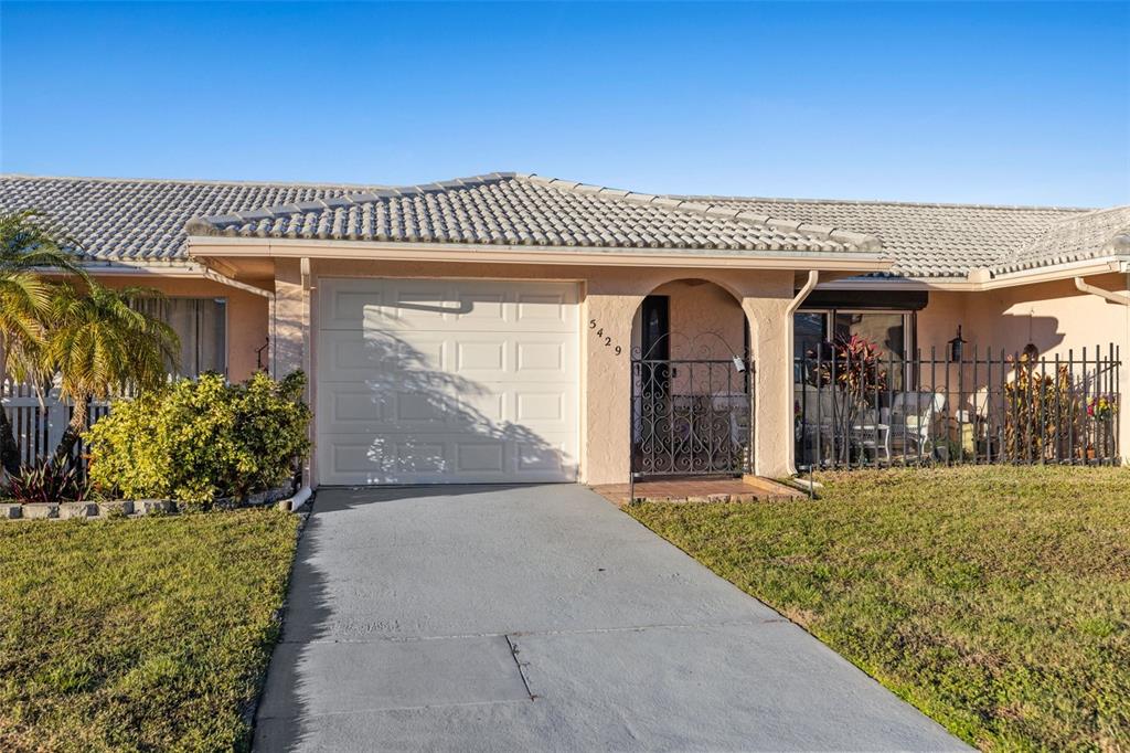 Under contract-accepting backup offers. Beautifully updated 2 bedroom, 2 bath, 1 car garage villa located in the 55+ subdivision of Springwood Villas II. This block villa has a spacious 1085 heated square feet open floor plan with a updated kitchen, updated bathrooms, newer flooring throughout , ceiling fans and appliances included (oven does not work). The AC and flat roof were replaced in December 2016. Enjoy your evenings in your private low maintenance backyard atrium. The monthly maintenance fee of $500 includes water, sewer, trash, basic cable, building insurance, ground maintenance, and recreational facilities. Don’t miss the opportunity to own in this lovely community with 2 ponds, a large clubhouse with lots of activities, heated pool, saunas, meeting/game room, modern workout room, shuffleboard courts and more. Two pets are allowed and must be under 25 pounds. Great location near shopping, restaurants, bus lines and Gulf Beaches. This is the perfect retirement or snow bird home.