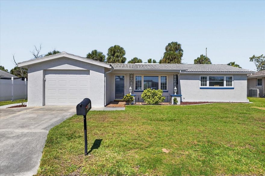 Location! Location! Location! Welcome home to this immaculate, beautifully remodeled home located in the highly coveted waterfront community of Gulf Harbors. Perfectly situated on a peaceful conservation lot, this property offers serene nature views, added privacy, and no rear neighbors. From the moment you walk into this move-in ready cottage, you will be wowed! A magical view of greenery and nature awaits; no rear neighbors except the eagles nest! This light and bright 1310 sq.ft., 2-bedroom, 2-bath, 1 car garage home features an inviting open-concept layout with a spacious living and dining area that flows seamlessly into the kitchen and breakfast nook. The updated kitchen showcases white craftsman-style cabinetry, granite countertops, a convenient eat-in bar, all new appliances and stylish stone-look tile flooring that enhances the home’s coastal charm. Over $115,000 in upgrades and improvements have been completed since 2020, including an additional $57,000 renovation in 2025. Recent updates also include a new flat roof, upgraded electrical panel, water heater, interior and exterior paint, new fencing, refreshed screens on the oversized screened porch, and beautiful brick paver walkways with an expansive 700 sq. ft. patio—perfect for outdoor entertaining or relaxing while enjoying the tranquil conservation views. Gulf Harbors offers an incredible Florida lifestyle with optional access to two private boat ramps, a private beach club, and an active civic association. Membership to the  private, gated, residents ONLY Gulf Harbors Beach Club is optional for just $200 a year which includes a 1/4 mile of white sandy beaches, chairs, cabanas, grills, and beach bathrooms! The neighborhood is golf-cart friendly and conveniently located just minutes from historic downtown New Port Richey, where you’ll enjoy waterfront dining, local shops, breweries, entertainment, Sims Park, pickleball courts, fitness centers, and more. Experience resort-style living year-round in this move-in-ready coastal retreat. Come see your next home today!