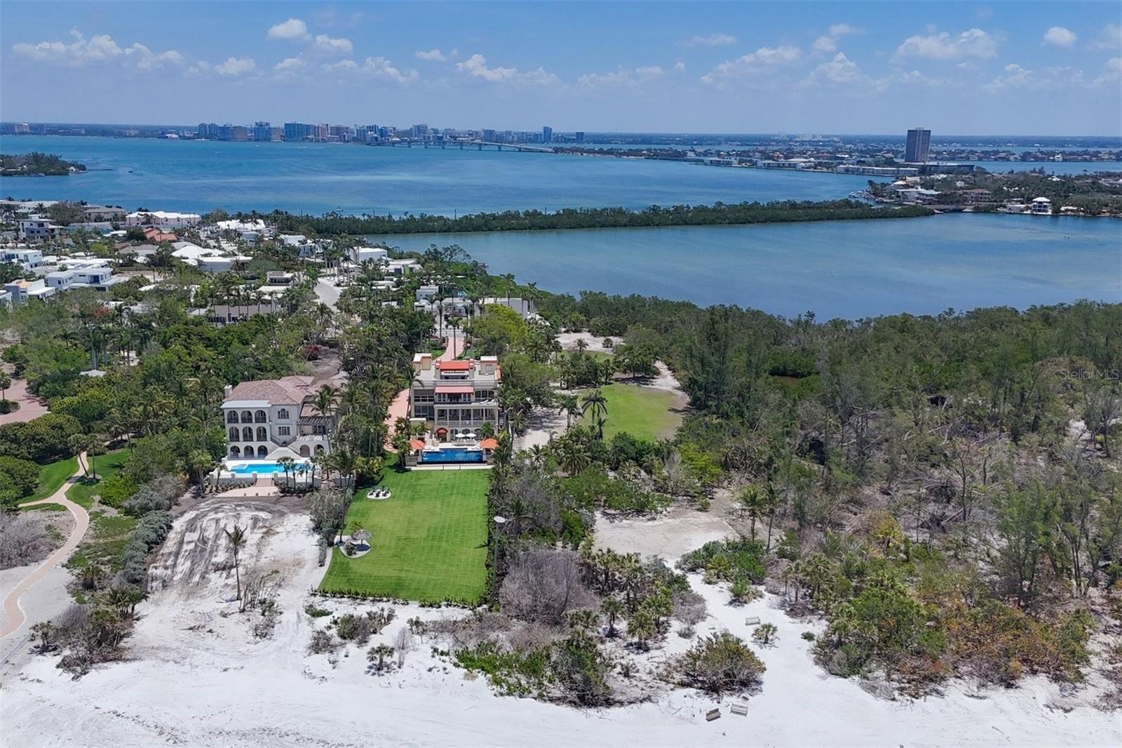 In the desired Lido Shores community, 1051 Westway Drive presents an unparalleled opportunity to craft a custom home with access to Pansy Bayou as well as potential for views of the Gulf of Mexico, the bay, sunsets and downtown Sarasota. This 0.87-acre lot offers an ideal setting for creating a custom residence on one of Sarasota’s world-famous barrier islands. In the Lido Shores neighborhood, this parcel features exclusive attributes including private beach access, a short walk to the luxury boutiques and eateries of St. Armands Circle, and proximity to the vibrant core of downtown Sarasota. With endless views and privacy of a nature preserve on one side, this property offers a rare chance to define your ultra-luxury lifestyle on the Gulf Coast of Florida. Adjacent parcel also available.