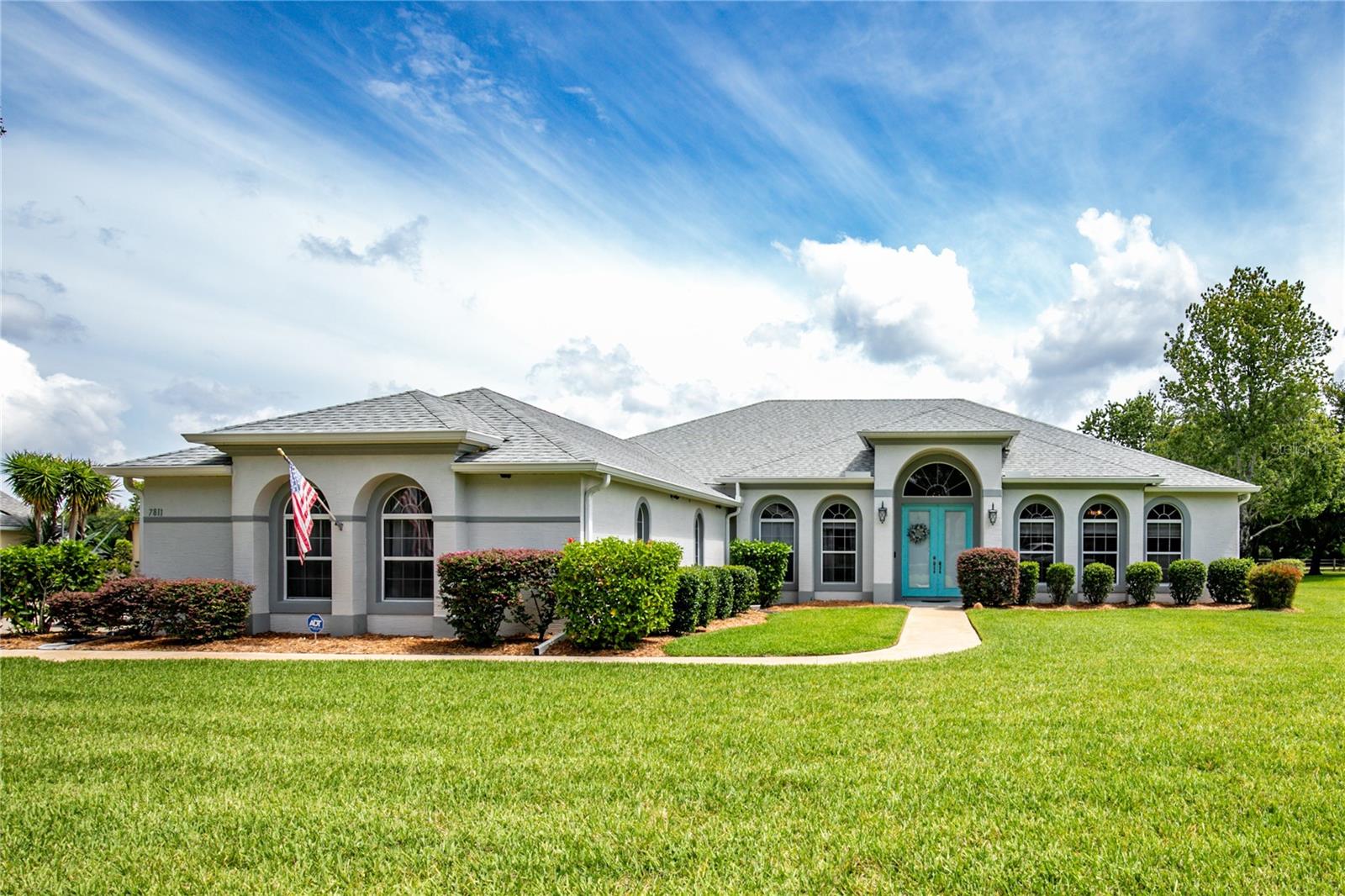 Move-In Ready Pool Home on One Acre in The Laurels of Mount Dora: Welcome to this meticulously maintained, one-owner home built by Shamrock, nestled on a lush and beautifully landscaped 1-acre lot in the highly desirable Laurels of Mount Dora community. Designed with both comfort and functionality in mind, this spacious 3-bedroom, 2-bath home offers an abundance of natural light, a split floor plan, and a warm, inviting layout perfect for everyday living and entertaining. Step through the formal living and dining rooms into a welcoming family room with custom-built-in cabinetry and a tray ceiling, creating a cozy yet elegant space. The heart of the home features a remodeled kitchen with sleek quartz countertops, a glass cooktop, stainless steel appliances, and ample cabinetry, ideal for the home chef. Enjoy seamless indoor-outdoor living with French doors leading to the private screened-in lanai and pool, where the recently painted deck and pristine landscaping set the stage for Florida living at its finest. The primary suite is a private retreat with dual vanities, a gorgeous jetted garden tub, a walk-in shower, and a separate toilet area, offering comfort and style. The guest bedrooms are generously sized and share a well-appointed second bath. Recent updates include a new water storage tank for the well, new pool pump, and new irrigation control box. A three-car garage provides ample storage and convenience. Located just minutes from historic downtown Mount Dora, The Laurels offers peaceful surroundings with large homesites, mature landscaping, and easy access to shopping, dining, airports, and area attractions. Don’t miss your opportunity to own this lovingly cared-for home in one of Mount Dora’s most sought-after communities. Schedule your private showing today and experience the charm of The Laurels for yourself!