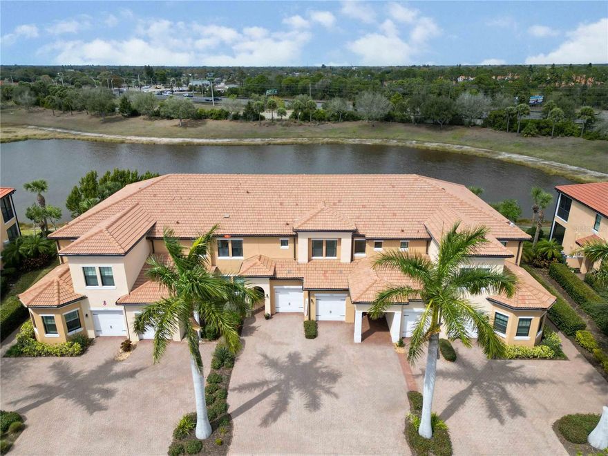 Step into your own piece of paradise with this impeccably maintained 2-bedroom, 2-bath + den residence, where breathtaking water views meet refined elegance. Located within the premier gated community of Sarasota National in Venice, this highly desirable second-floor unit offers the ultimate Florida retreat. Built by WCI in 2017, the home lives like a single-family residence and features 1,988 square feet of thoughtfully designed living space with a spacious open-concept floor plan. Impact glass windows and sliding doors provide peace of mind while allowing natural light to fill the home.
The true highlight is the expansive lanai, where you can unwind each evening while enjoying spectacular sunsets over the lake—arguably one of the most private and picturesque views in the entire community, with no buildings behind you. The gourmet kitchen is designed to impress, showcasing granite countertops, 42-inch soft-close cabinetry, roll-out shelving, and under-cabinet lighting.
The private primary suite serves as a peaceful retreat, complete with a spa-inspired ensuite bath featuring dual quartz vanities, a frameless glass shower, and an impressive 10' x 12' walk-in closet. A split-bedroom layout provides ideal privacy for guests, while the den  offers the perfect space for a home office, study, or hobby room.
Additional highlights include upgraded fixtures, a spacious laundry room with utility sink, and an oversized one-car garage (24' x 11').
Embrace the “living on vacation” lifestyle with full Palm Club access. The quarterly HOA covers exterior maintenance, water, sewer, trash, basic cable, pest control, irrigation, and complete access to Sarasota National’s exceptional resort-style amenities.
Residents enjoy:
• 30,000 sq. ft. clubhouse with fine dining, tiki bar, coffee lounge, and year-round social events
• Resort-style zero-entry pool and spa, plus a dedicated lap pool
• State-of-the-art fitness center, spa, tennis, pickleball, and bocce courts
• Miles of scenic trails within a protected Audubon sanctuary, along with a community dog park