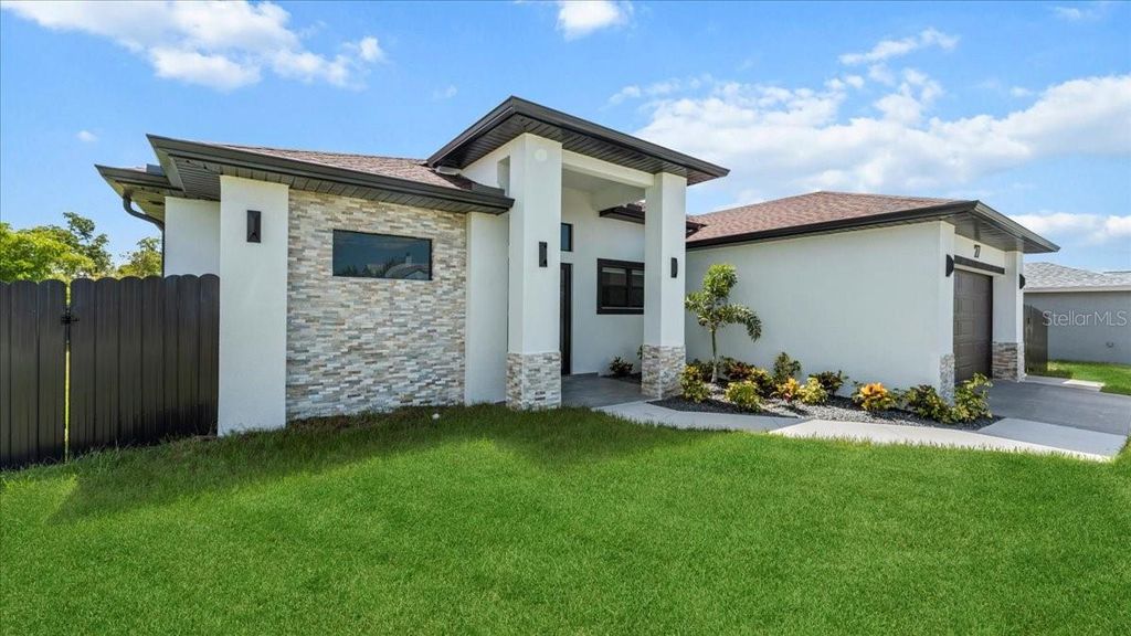 Photo of 27 SW 8th Place, Cape Coral, FL 33991 (MLS # A4666905)