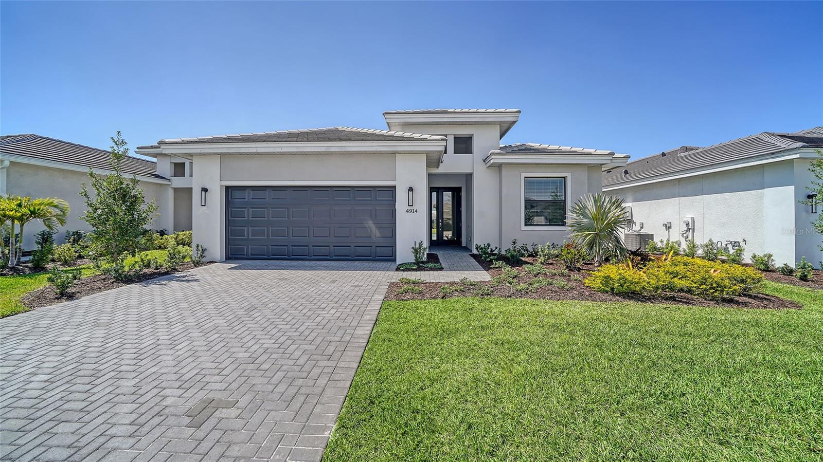 **NEW CONSTRUCTION** This Dania home features 3 bedrooms, 3 Bath, and Den, open great room and separate casual dining area. Enjoy an extended covered lanai with Western exposure and water view with a gourmet kitchen and prep for a future summer kitchen. Design includes wood-look luxury vinyl flooring throughout the main living area, den and owner's suite. Guest suites are carpeted. The Master Bath features a frameless shower enclosure, frameless style cabinetry, designer plumbing, with tile extending to the ceiling in all bathrooms. Located in the Lakewood Ranch, this home is filled with natural light from large windows. Cresswind Lakewood Ranch Residents enjoy access to a resident-exclusive clubhouse that features outdoor activities including pickleball & tennis courts; a dog park with large and small breed sections; wide lighted walkways; resort style pool and spa; resistance pool; event plaza with food court truck; bocce courts and The Cresswind SmartFIT Training Center powered by EGYM and the state of the art fitness system that helps you reach your fitness goals with 20 minute workouts, twice a week. The full-time Lifestyle director keeps the social and event calendar full of activities designed for the 55+lifestyle.