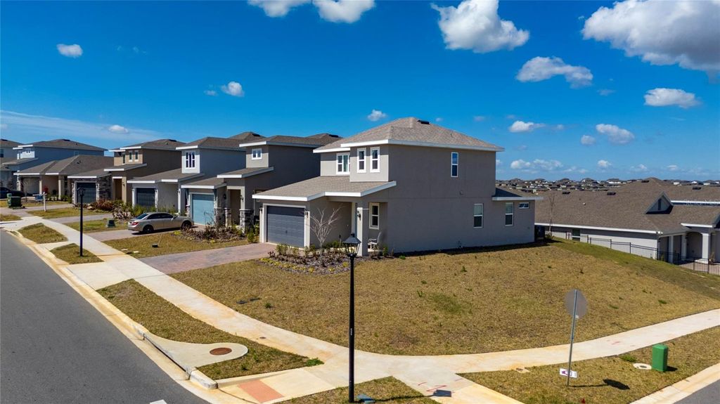 Photo of 2040 Sunshine Peak Drive, Minneola, FL 34715 (MLS # O6389802)