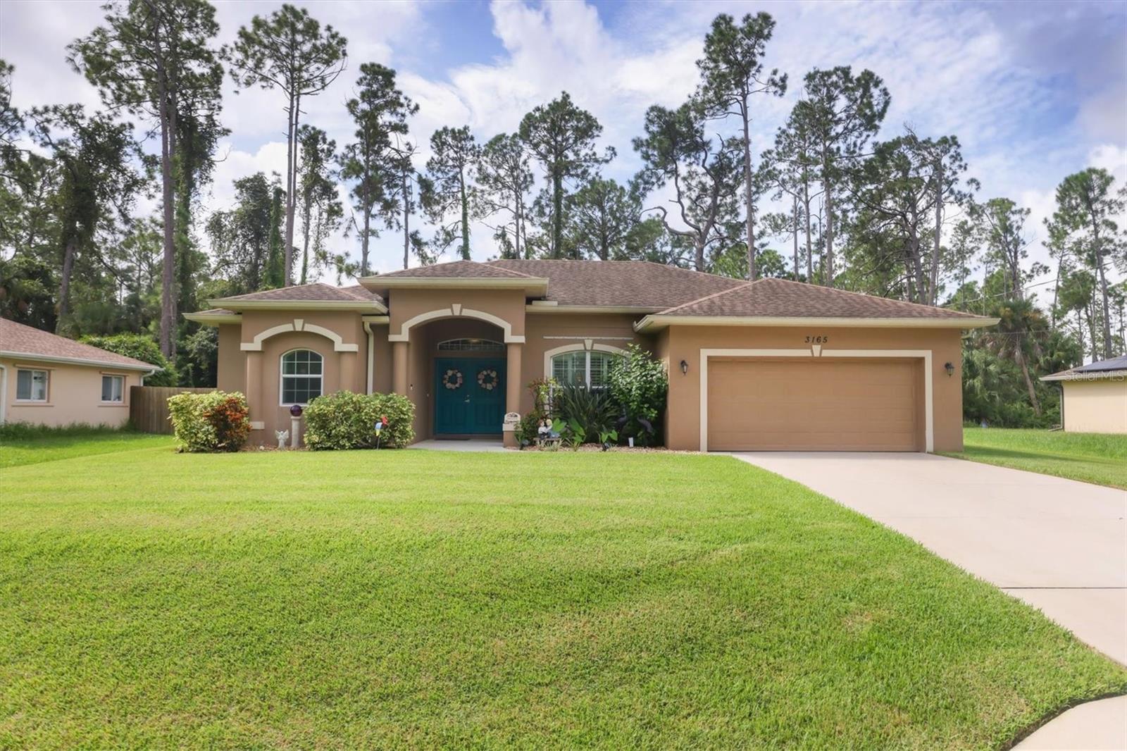 Step into a home designed for both comfort and style in North Port. This 3-bedroom, 2-bathroom residence with a BRAND NEW A/C offers a thoughtful split-bedroom layout, providing privacy and ease of living. As you enter, you’re welcomed by a spacious living room, perfect for gatherings, with a dining area just off to the right. The heart of the home is the open kitchen that flows seamlessly into a second living space and a cozy dinette area. The kitchen itself is an entertainer's dream with an island that accommodates barstool seating—ideal for casual meals or chatting with guests while cooking. The primary suite, located at the front of the house, boasts a walk-in closet and an en suite bathroom featuring a soaking tub, walk-in shower, and all the space you need to unwind. On the opposite side of the home, two secondary bedrooms share a full bathroom, offering separation and convenience for family or guests. Sliding doors from both the first living room and the dinette lead you outside to your personal oasis. The screened-in lanai has both a covered seating area and additional space just under the screen for lounging. A sparkling inground pool with a stunning waterfall feature creates the perfect backdrop for relaxation and outdoor fun. Adding to the home's appeal is the energy-efficient SOLAR panel system, which helps to significantly reduce utility bills and supports a more sustainable lifestyle. Practical features like an inside laundry room and a two-car garage make this home as functional as it is charming. Even better, there’s NO HOA, giving you the freedom to personalize your property without the restrictions or fees typically imposed by an HOA, whether that means enhancing the landscaping, adding custom features, or simply enjoying the flexibility of doing things your way. This North Port home truly combines comfort, efficiency, and freedom, offering a versatile living experience.