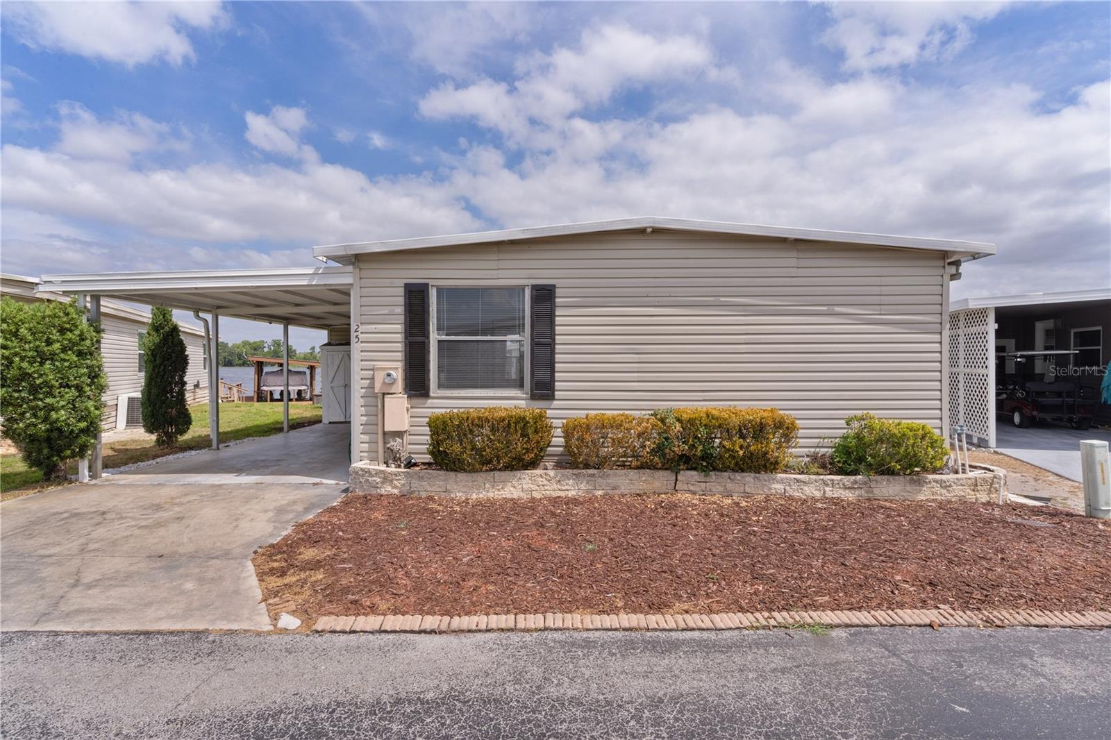 *** PRICE REDUCTION***
Lake Griffin Waterfront Property is looking for New Owners. This 2 Bedroom/ 2Bath remolded home Sits above Lake Griffin. A Rare (10ft x 66ft), Enclosed Wrap-Around Porch Affords it's New Occupants a Panoramic View of this Beautiful Lake. The house itself is an Open, Blank Canvass with many Options to Create Your Own Perfect Retirement or Investment Oasis. This Structure is Solid, Freshly Painted with New Sub-Flooring with Vinyl Covering, New Carpet and Tiled Bathroom Flooring. New Kitchen Cabinets, Microwave, Countertops and Sink. The Inside Laundry Room was fitted with New Plumbing, Insulation and Drywall. New Vanities were installed in both Bathrooms; and New Ceiling and Cam Lights in the Master Bedroom. The Photos show a Wide Open floor plan that can accommodate your personal Waterfront Dream Home.
Harbor Oaks is a Premier Community. The $125./Mo Fee Includes Trash, Water and Mowing. Come see this Property and Create Your Own Waterfront Little Slice of Heaven.