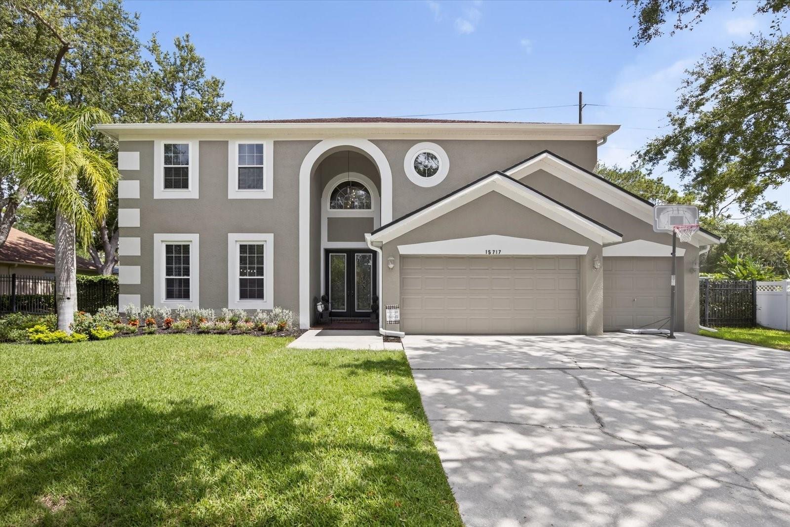 Welcome to 15717 Berea Dr, a beautifully updated 5-bedroom PLUS bonus room, heated POOL home in the sought-after Arbor Lakes community of Odessa with NO CDD. The flexible floor plan includes a downstairs bedroom/office and full bath with direct pool access, perfect for guests or multigenerational living. Upstairs you'll find a huge bonus room that can easily function as a 6th bedroom OR can be used as a game room, movie theater, home schooling classroom and more! Your upstairs primary suite is its own luxury retreat with a large en-suite bathroom and dual, built-in closets, walk-in shower, and garden tub. TONS OF RECENT upgrades include brand new kitchen cabinets with quartz countertops (2023), black stainless steel appliances, coffee bar and built-in pantry, luxury vinyl plank flooring upstairs, new upstairs ductwork (2023), new upstairs A/C in 2023, and a new water heater in 2022. The exterior features fresh paint, new gutters, a fully re-screened lanai (2023), brand new landscaping, and a completely re-sodded yard. Don't miss the NEW Energy-Saving, IMPACT windows throughout the home valued at $35,000! Enjoy a private backyard oasis FULLY FENCED IN with no rear neighbors where you can often spot birds, deer, and bunnies in the natural surroundings. Arbor Lakes offers a park with a playground, tennis/pickleball court, picnic tables, a gazebo, and community events held throughout the year. Located in a top-rated school zone and close to shopping, dining, and major roads. Approx 10 minutes to Citrus Park Mall and access to the Veterans Expressway. Nearby county parks include Keystone Park (playgrounds, basketball courts, tennis and pickleball courts, library), Peterson Road Park, Ed Radice Sports Complex and access to the Upper Tampa Bay Trail.