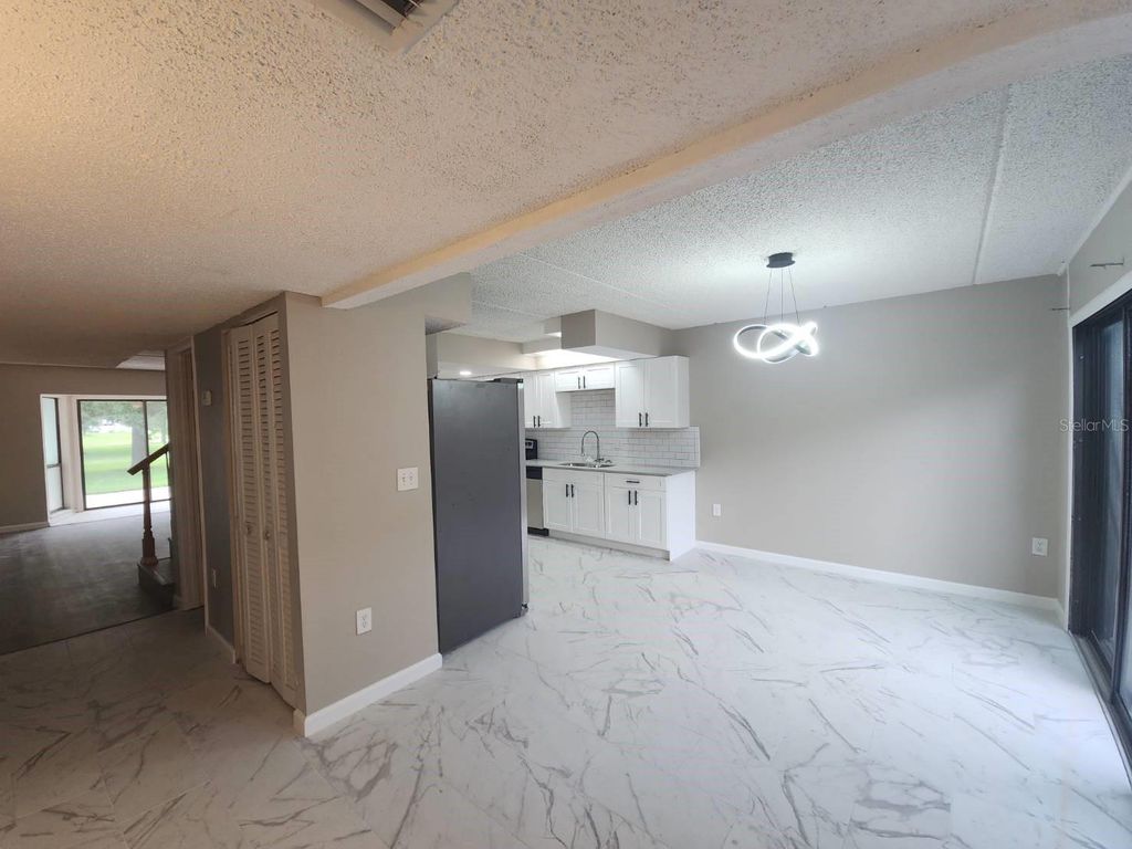 Photo of 5132 Cypress Creek Drive #104, Orlando, FL 32811 (MLS # O6409244)