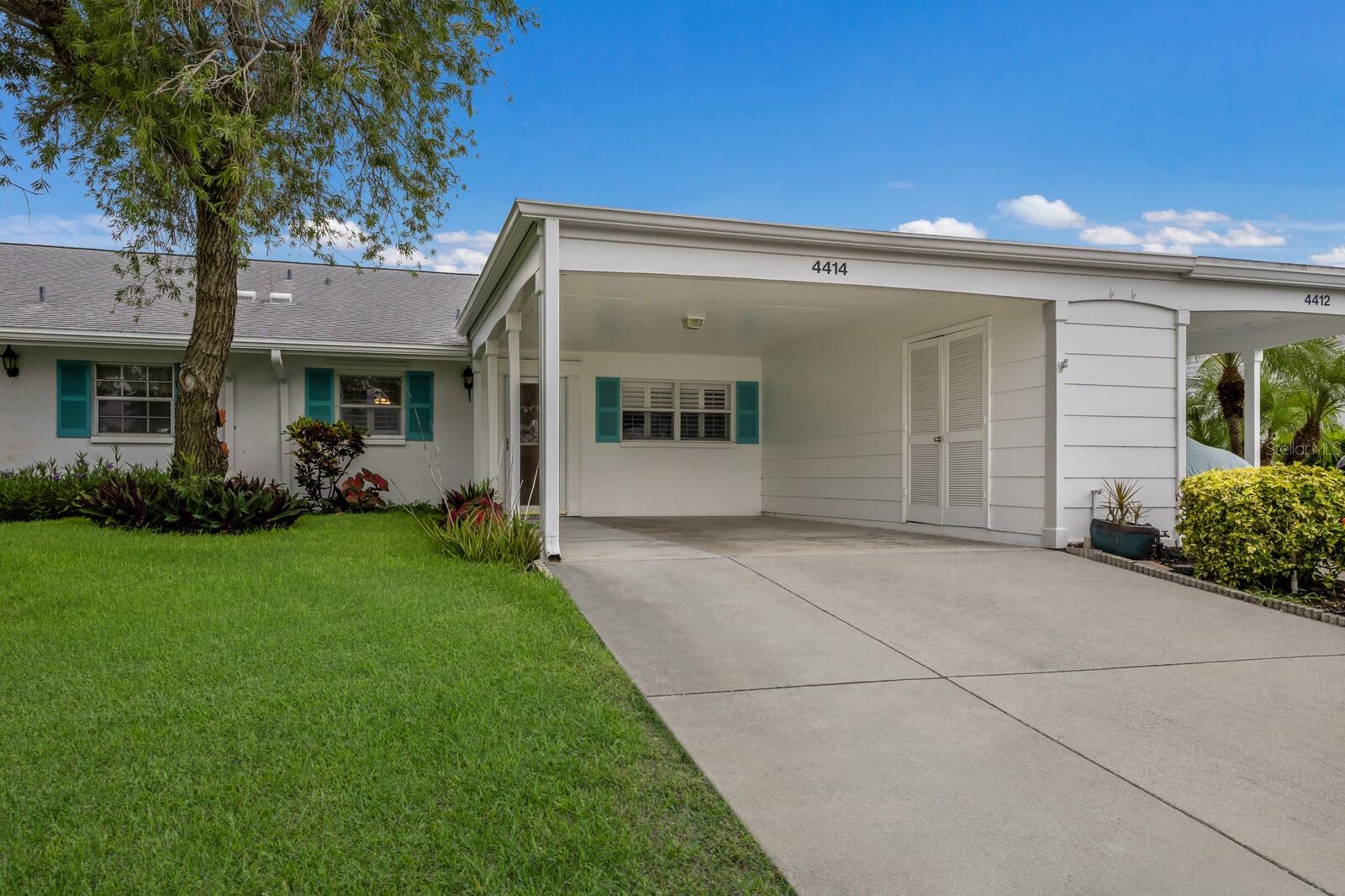 Welcome home to this lovely villa in Mt. Vernon. Tucked away in this water front community, this villa offers you beautiful partial water views of one of the lakes from your back yard patio, from the primary bedroom and from the Florida room. This villa boasts over 1300 feet of interior space and an additional 250 Sq. Ft of interior space from the Florida room that has been enclosed under air conditioning. This villa has been beautifully updated with lovely vinyl flooring, open kitchen with breakfast bar, dining room, base boards, updated primary bathroom, new roof in 2019, a new hot water heater in 2021, and a brand new AC system in 2022. Mt. Vernon is a lovely active community, with beautiful pathways and landscape, great for walking, biking, bird watching, fishing, and dolphin watching. This villa also features an oversized carport with storage. If you are a boater you can rent a boat slip for $25 a year. Community amenities include a huge remodeled clubhouse, banquet room, billiards, ping- pong, library, game room, lakeside veranda, heated pool, tennis, pickle ball, and covered shuffleboard courts, spa, sauna, workshop, wood shop, chip and putting green, walking paths, butterfly garden, bay front park, kayak launch/storage, bayside pavilion, lakeside gazebo, and numerous lakes/ponds all spread across nearly 90 acres while nestled within an abundance of Florida wildlife. This community also hosts a variety of activities and social events for residents to enjoy. If you are looking for a quaint and tranquil but active outdoor type of community than this villa and Mt. Vernon is the place for you.