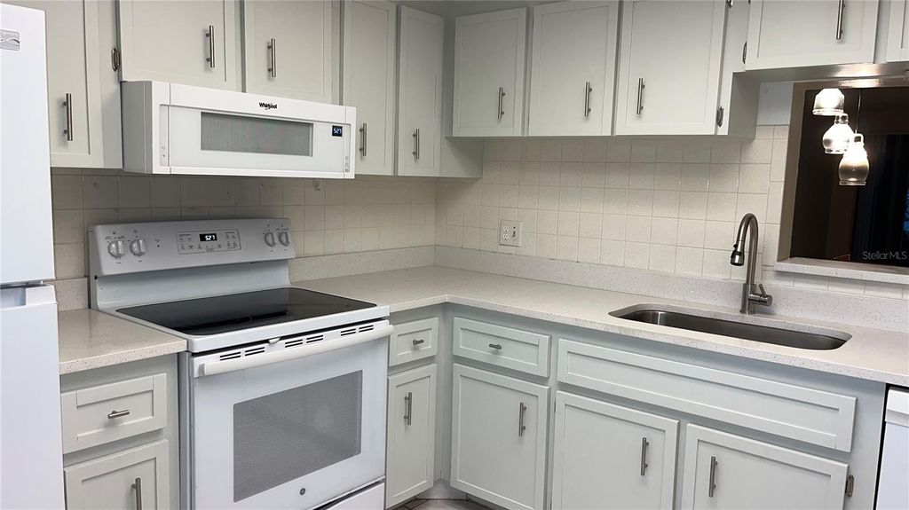 Photo of 871 New York Avenue #104, Dunedin, FL 34698 (MLS # TB8458848)