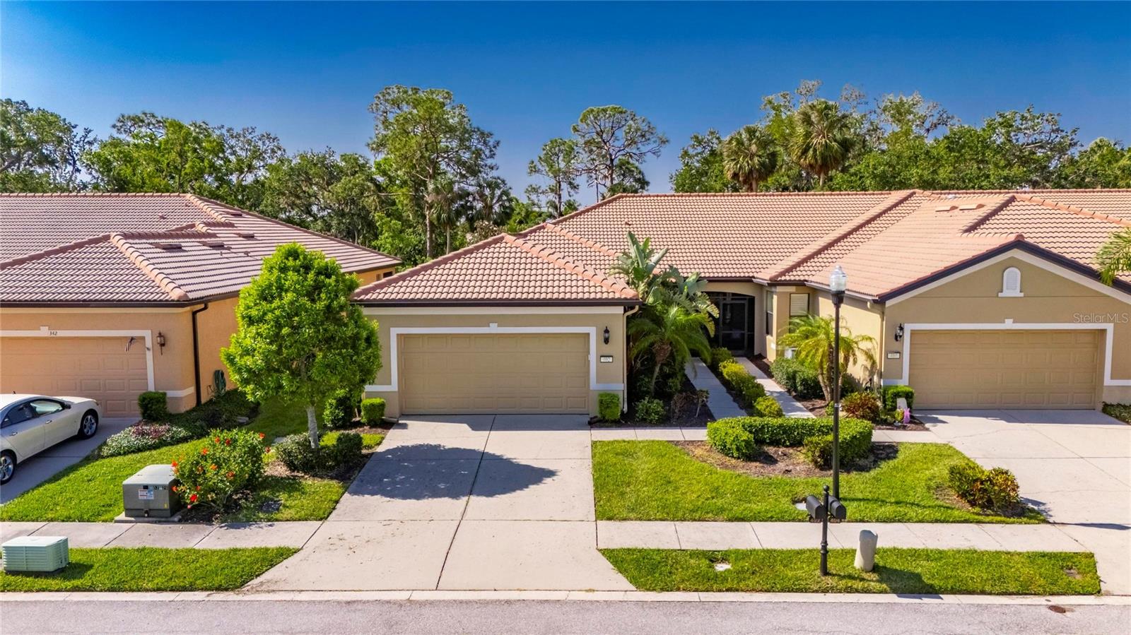 Look no further... METICULOUSLY MAINTAINED 2 bedrooms, with an office/den, 2 bath 2 car garage villa located on a beautiful waking trail in the maintenance free living of Southshore Falls..... This beautiful villa is move in ready. Screened entrance, gorgeous glass front door with magnetic screened door. Wonderful cross breeze throughout the home during the cooler months. This pristine condition home boasts an open kitchen with breakfast bar and room for bistro seating. Many upgrades in the home including new A/C shower with glass enclosure, shutters, stainless steel appliances, granite countertop, custom backsplash, custom window treatments and extended tile lanai. Split floorplan works great for when you have guests. As you step outside into the very private extended tile lanai enjoy the peace and quiet of no backyard neighbors. Perhaps enjoy a cup of coffee or an adult beverage with a good book or watch the ever-changing views of nature on the beautiful walking trail. Landscaping maintained by HOA. COME CHECK THE STATE OF THE ART RESORT STYLE AMENITIES... YOU WILL BE WANTING TO PROLONG YOUR VISIT WITH A DIP IN THE BEAUTIFUL POOL OR RELAX AT THE CLUBHOUSE. You will never be bored in this gated community that offers lots of social activities and clubs. 3 pools, including LAGOON POOL, RESISTANCE POOL, AND EAGLES NEST POOL are all heated, hot tub, clubhouse, with state-of-the-art fitness center! Casual coffee cafe, hobby/craft room, Ballroom, library/card room, billiards, putting green, shuffleboard and bocce ball courts!! Walking trails, tennis and pickleball courts, fitness, and a community that allows pets. NO CDD, don’t miss your opportunity and make this your home today!! Easy to view. Chat with the neighbors and learn first hand what this community has to offer... plan on relaxing at the pool or enjoying some exercise at the pickleball courts or gym, or perhaps playing cards, or Bingo or crafts.. so much to do.. so stop by and hear all about the fun your new friends and neighbors are experiencing living in this beautiful community. Make an appointment to view. Easy to view. YOU WILL NOT BE DISAPOINTED! Some Furnishings available for purchase under separate contract.