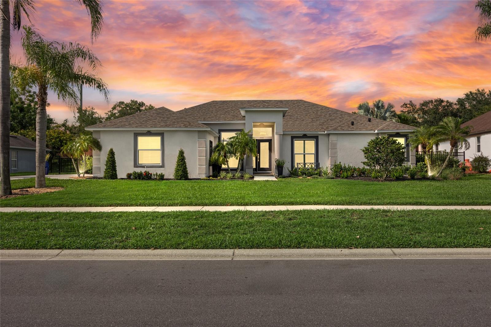 Back on the market! Huge price improvement!! Motivated sellers! Don’t miss out on this incredible opportunity within the sought-after Johns Cove gated community! This small, sought-after gated community on Johns Lake is ideally located just off the Florida Turnpike, close to Old Winter Garden, the airport, and all the Attractions. The community has its own private boat ramp, providing access to Johns Lake, which is renowned for fishing, boating, jet-skiing, and paddle boarding. Welcome to this stunningly, beautifully remodeled 4-bedroom, 2-bathroom custom pool home—truly turn-key and move-in ready! This home has been completely updated in 2024, offering stylish living and peace of mind from day one. From the moment you arrive, you’ll be impressed by the manicured lawn and vibrant flower beds. The side-entry two-car garage adds to the home’s fantastic curb appeal. Step inside through the foyer to a beautiful, freshly remodeled and painted interior that opens into a spacious dining area. This home features a split floor plan—with the primary suite and one bedroom on one side, and two additional bedrooms and a full bath on the other, offering flexibility for families and guests alike. The primary suite is a true retreat, complete with a luxurious en-suite bathroom featuring a custom tub, walk-in shower, and a stunning walk-in closet. All finishes, including elegant porcelain tile flooring, are brand new. The heart of the home is the expansive open-concept kitchen and living area, highlighted by an oversized quartz island with a farmhouse-style sink—perfect for entertaining. The custom-designed kitchen offers modern cabinetry, sleek finishes, and seamless access to the family room. Enjoy cozy evenings in the family room, which showcases a state-of-the-art electric fireplace and a custom entertainment bar. From here, step through the doors to your covered outdoor seating area and brand-new 2024 custom pool, featuring a sun shelf and tranquil water fountain—perfect for relaxing or hosting. Additional features: New roof, windows, HVAC system, and tankless water heater (2024), Fully fenced backyard—great for pets. Fresh exterior and interior paint (2024). This fully renovated home combines luxury, comfort, and convenience in one of the most desirable communities in the area. It won’t last long—schedule your private showing today!