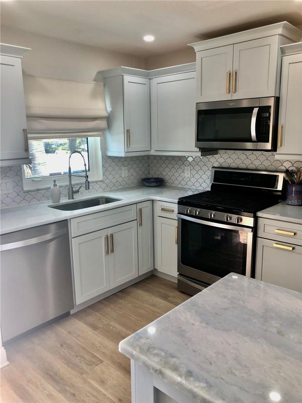 Photo of 7 Dunoon Place #203, Dunedin, FL 34698 (MLS # W7880069)