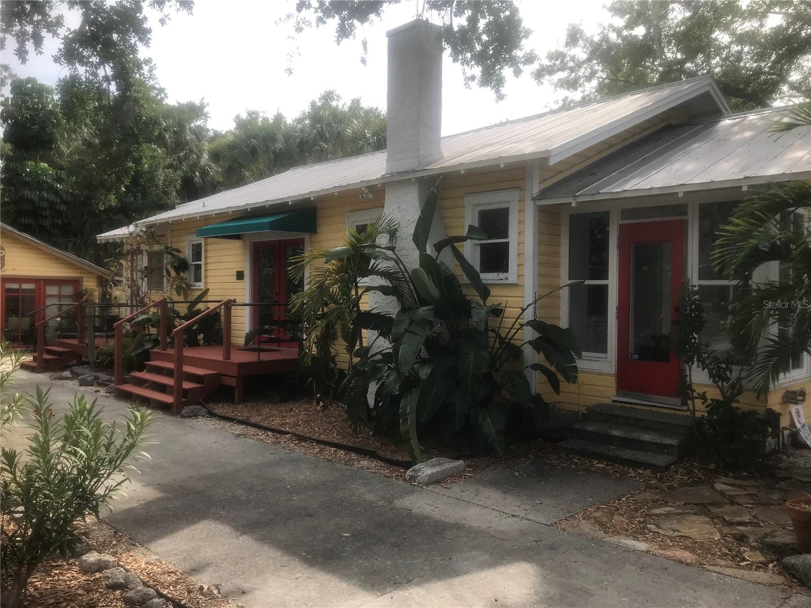 Live, work or both in the heart of the downtown Towle's Court community. The home was originally built in the 1930s but has many upgrades including new windows and flooring. The property is just a short walk to downtown Sarasota with many restaurants, taverns and shopping. The house has just been remodeled with a new kitchen with a farm house sink, new tile and vanity in full bathroom and all new stainless steel appliances. There is a separate building on the property that houses a hair salon. The property offered for rent has a large main room with a working fire place, a front room with full windows looking out onto Adams Lane, two side rooms, 1 full bathroom, a half bath in one of the bedrooms, a kitchen and a laundry area with a stacked washer/dryer. Each room has its own door leading to the outside of the building. There is a paved space area in the back with a deck off the back room that is shared with the hair salon. There are small decks on the side of the building as well. Directly next door is Indigenous restaurant and a vacant lot on the other side of the property. There are wood floors in the living room and bedrooms, new tile in the bathroom, new vinyl tile in the kitchen and laundry area. The home has been previously used as a home residence, a recruiting agency, an art gallery, and a retail store. Could also be used for day spa, or any professional office. 4 parking spots available in the front of the building. The property is zoned for commercial and residential use. Please contact Michael at the listed number if interested in viewing the property.